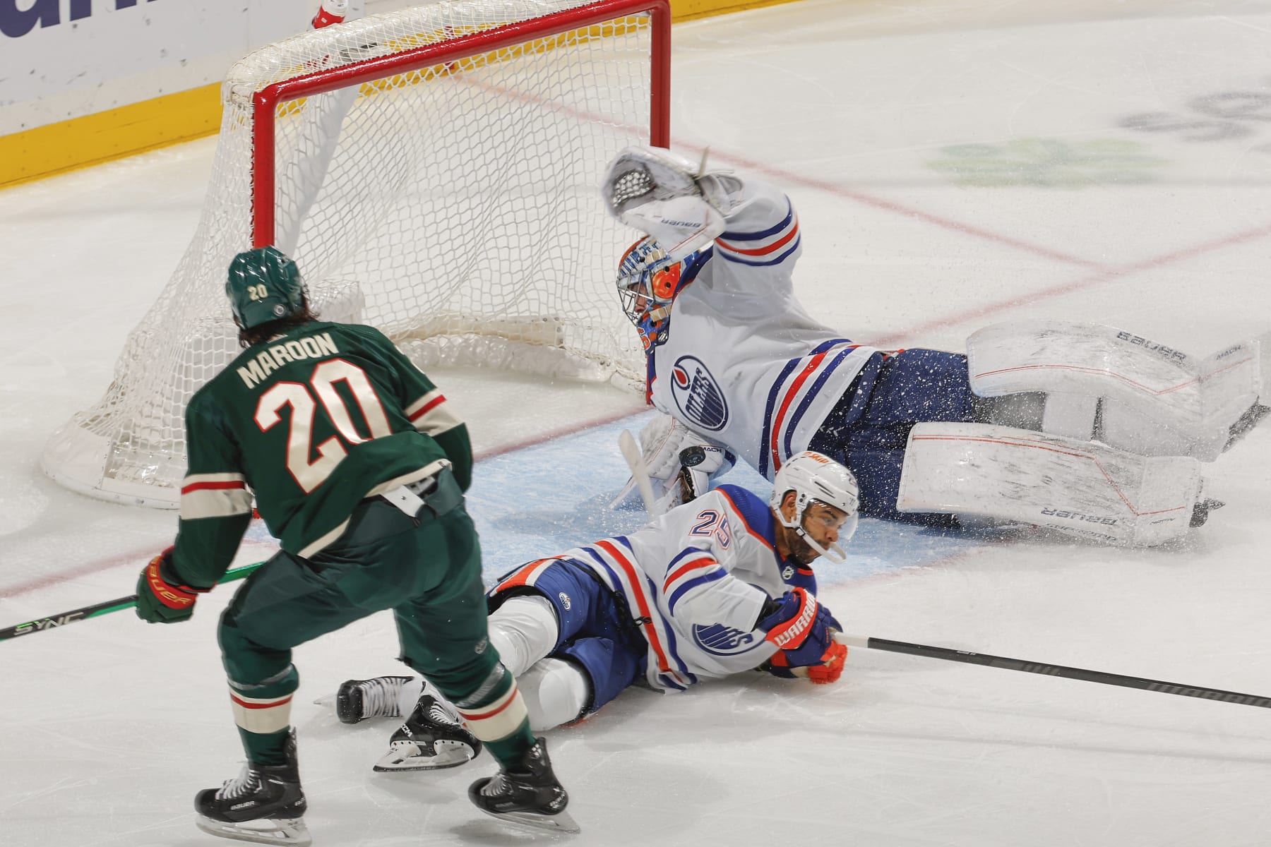 SAINT PAUL, MN - OCTOBER 24: Jack Campbell #36 makes a save while his teammate Darnell Nurse #25 of the Edmonton Oilers defends against Pat Maroon #20 of the Minnesota Wild during the game at the Xcel Energy Center on October 24, 2023 in Saint Paul, Minnesota. (Photo by Bruce Kluckhohn/NHLI via Getty Images)