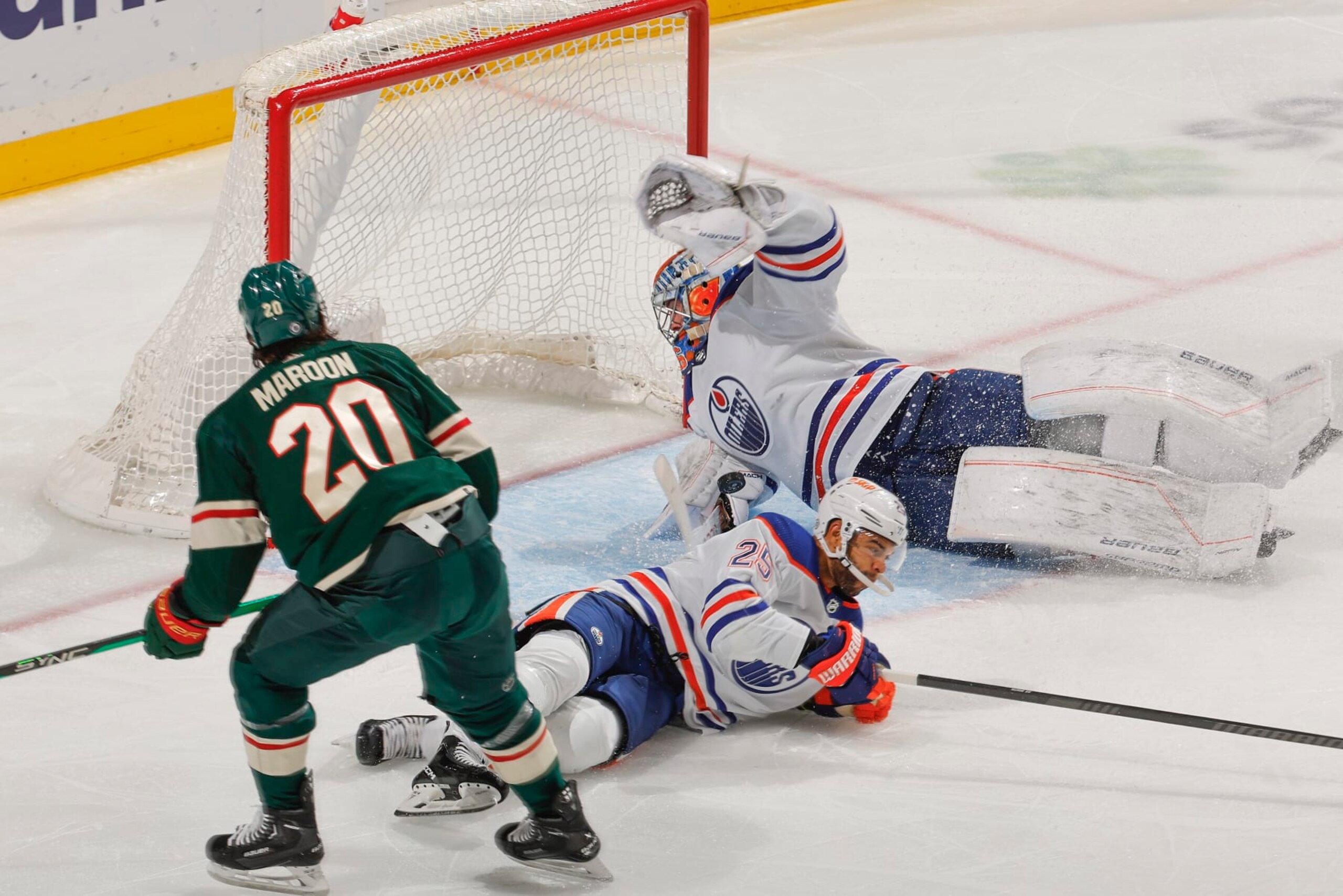 SAINT PAUL, MN - OCTOBER 24: Jack Campbell #36 makes a save while his teammate Darnell Nurse #25 of the Edmonton Oilers defends against Pat Maroon #20 of the Minnesota Wild during the game at the Xcel Energy Center on October 24, 2023 in Saint Paul, Minnesota. (Photo by Bruce Kluckhohn/NHLI via Getty Images)