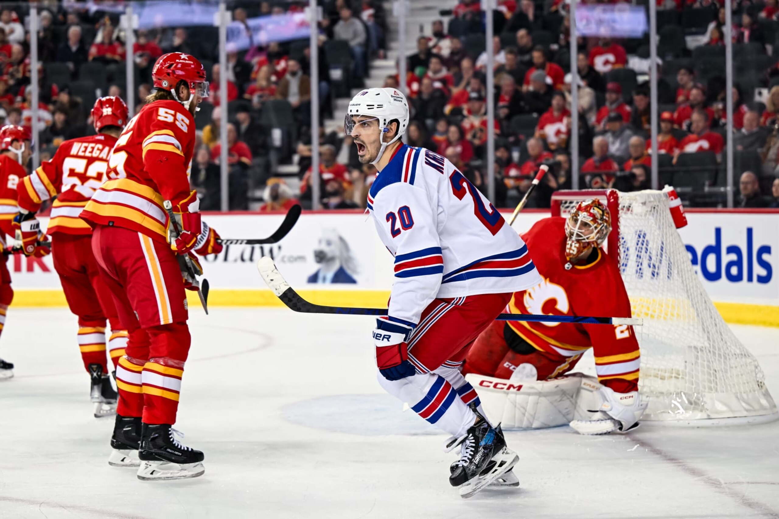 CALGARY, AB - OCTOBER 24: New York Rangers Left Wing Chris Kreider (20) celebrates after scoring a goal on Calgary Flames Goalie Jacob Markstrom (25) during the second period of an NHL game between the Calgary Flames and the New York Rangers on October 24, 2023, at the Scotiabank Saddledome in Calgary, AB. (Photo by Brett Holmes/Icon Sportswire via Getty Images)