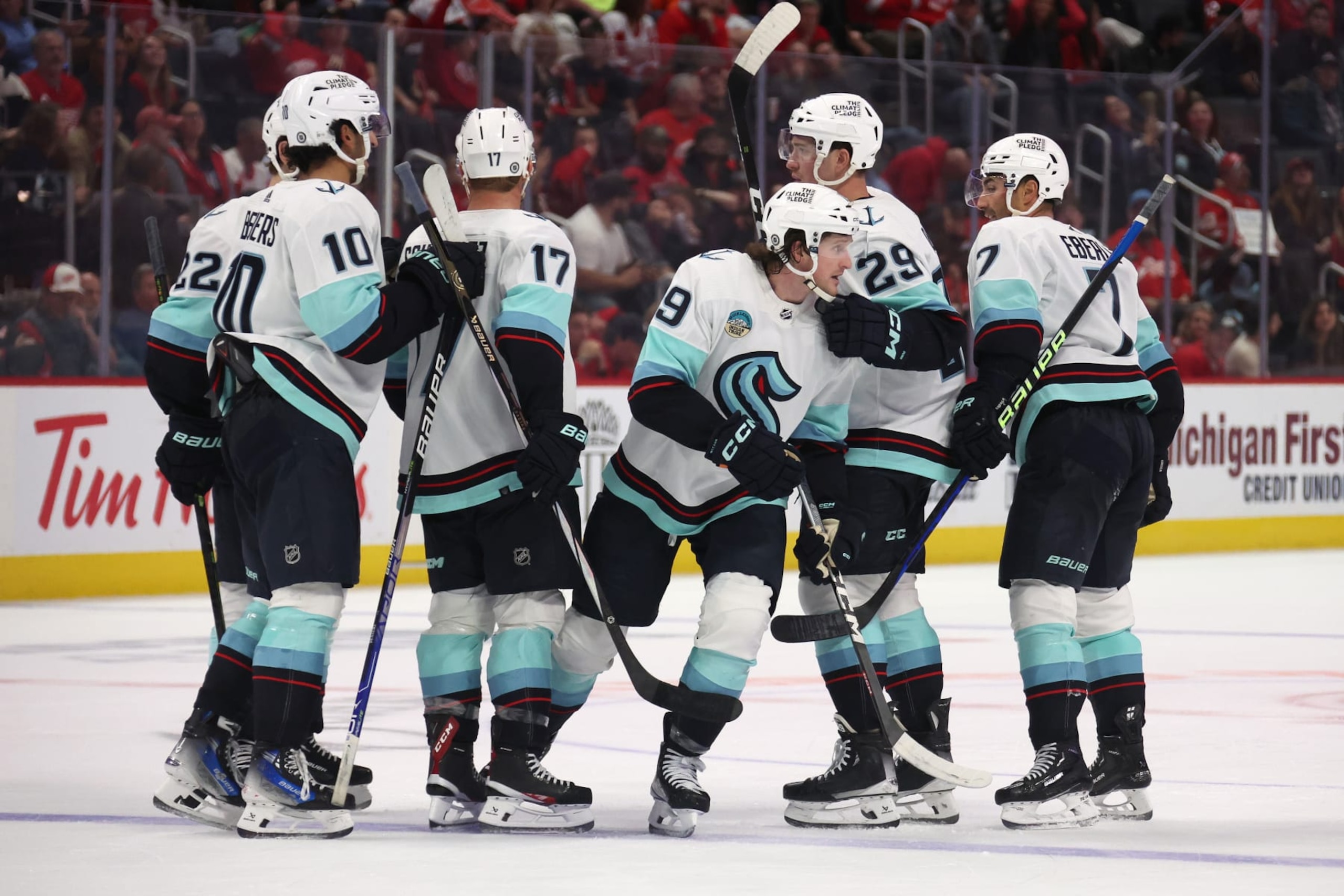 DETROIT, MICHIGAN - OCTOBER 24: Jared McCann #19 of the Seattle Kraken celebrates his third period goal with teammates while playing the Detroit Red Wings at Little Caesars Arena on October 24, 2023 in Detroit, Michigan. (Photo by Gregory Shamus/Getty Images)