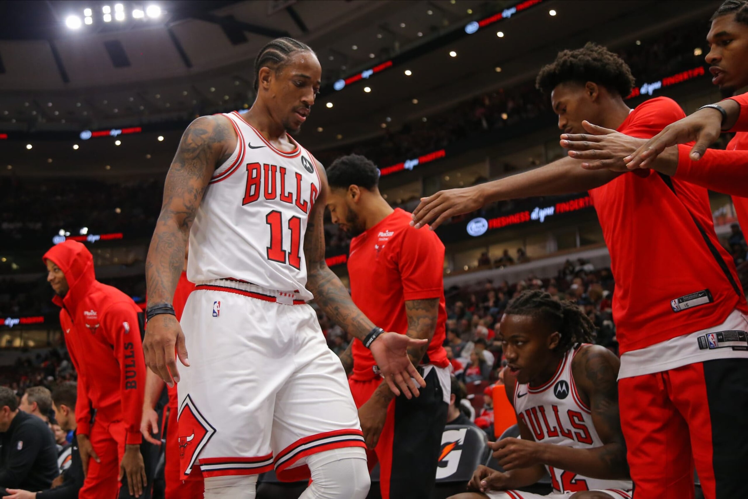 CHICAGO, IL - OCTOBER 19: Chicago Bulls forward DeMar DeRozan (11) looks on as he walks back to the bench during a NBA game between the Minnesota  Timberwolves and the Chicago Bulls on October 19, 2023 at the United Center in Chicago, IL. (Photo by Melissa Tamez/Icon Sportswire via Getty Images)