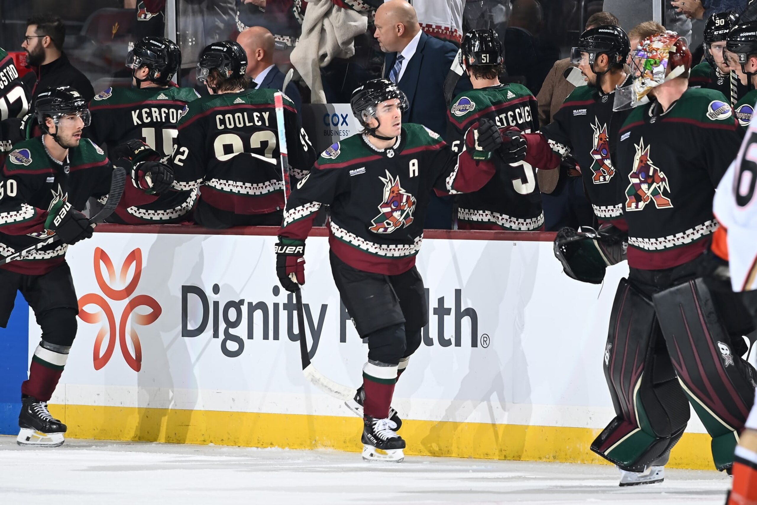 TEMPE, ARIZONA - OCTOBER 21: Clayton Keller #9 of the Arizona Coyotes celebrates with teammates on the bench after scoring a goal against the Anaheim Ducks during the second period at Mullett Arena on October 21, 2023 in Tempe, Arizona. (Photo by Norm Hall/NHLI via Getty Images)