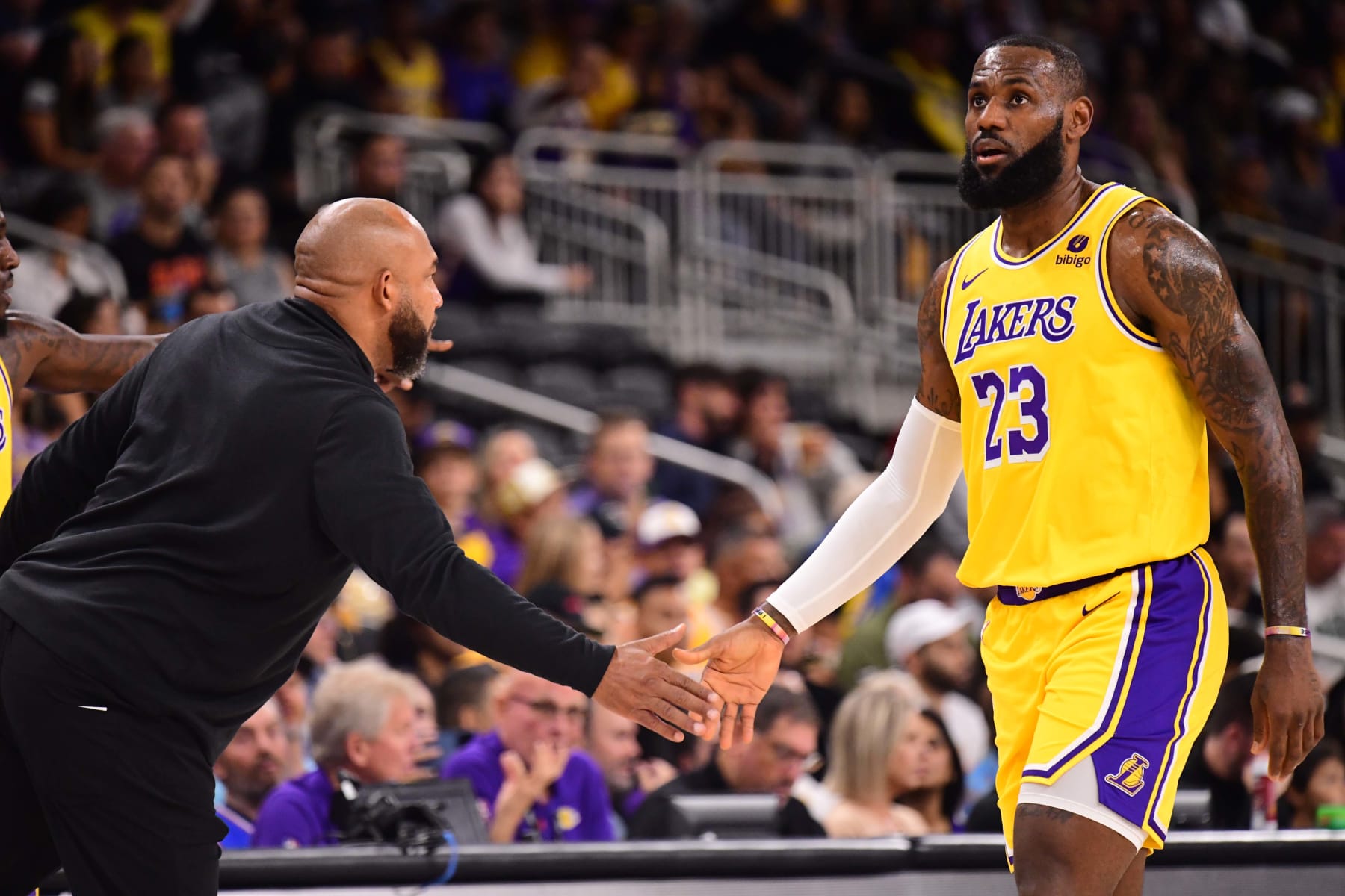 PALM SPRINGS, CA - OCTOBER 19: Head Coach Darvin Ham and LeBron James #23 of the Los Angeles Lakers high fives during the game against the Phoenix Suns on October 19, 2023 at the Acrisure Arena in Palm Springs, California. NOTE TO USER: User expressly acknowledges and agrees that, by downloading and/or using this Photograph, user is consenting to the terms and conditions of the Getty Images License Agreement. Mandatory Copyright Notice: Copyright 2023 NBAE (Photo by Adam Pantozzi/NBAE via Getty Images)
