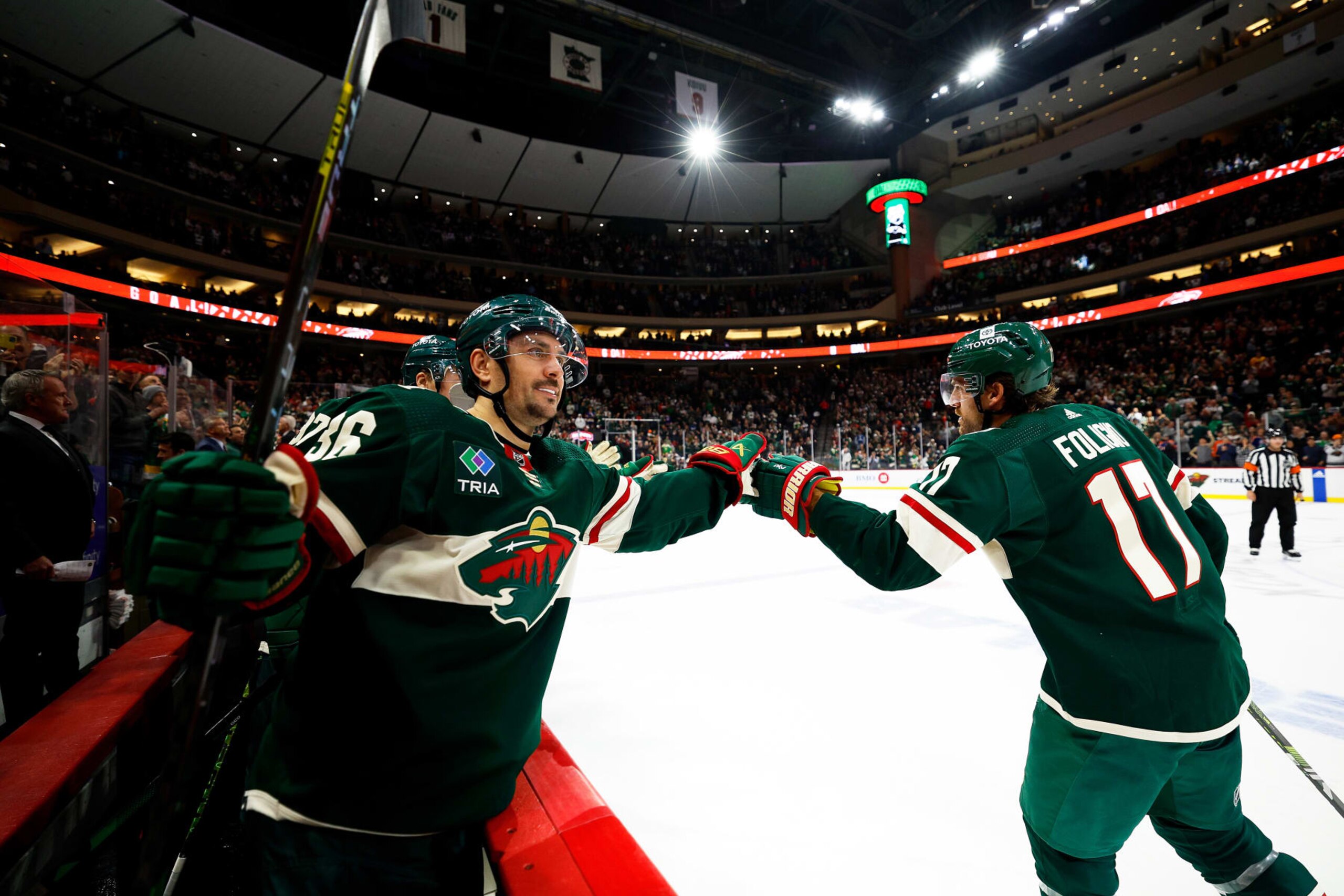 ST PAUL, MINNESOTA - OCTOBER 24: Marcus Foligno (R) #17 of the Minnesota Wild celebrates with teammate Mats Zuccarello #36 after his empty net goal in the third period against the Edmonton Oilers at Xcel Energy Center on October 24, 2023 in St Paul, Minnesota. The Wild defeated the Oilers 7-4. (Photo by David Berding/Getty Images)