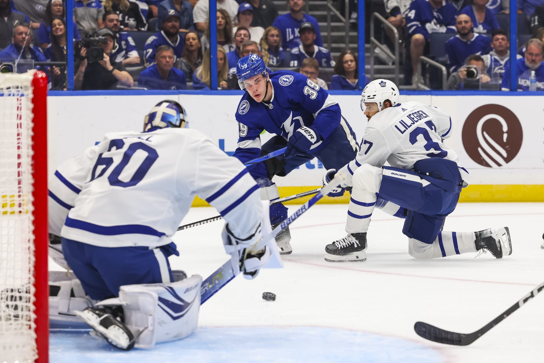 TAMPA, FL - OCTOBER 21: Waltteri Merela #39 of the Tampa Bay Lightning against goalie Joseph Woll #60 and Timothy Liljegren #37 of the Toronto Maple Leafs during the first period at Amalie Arena on October 21, 2023 in Tampa, Florida. (Photo by Mark LoMoglio/NHLI via Getty Images)