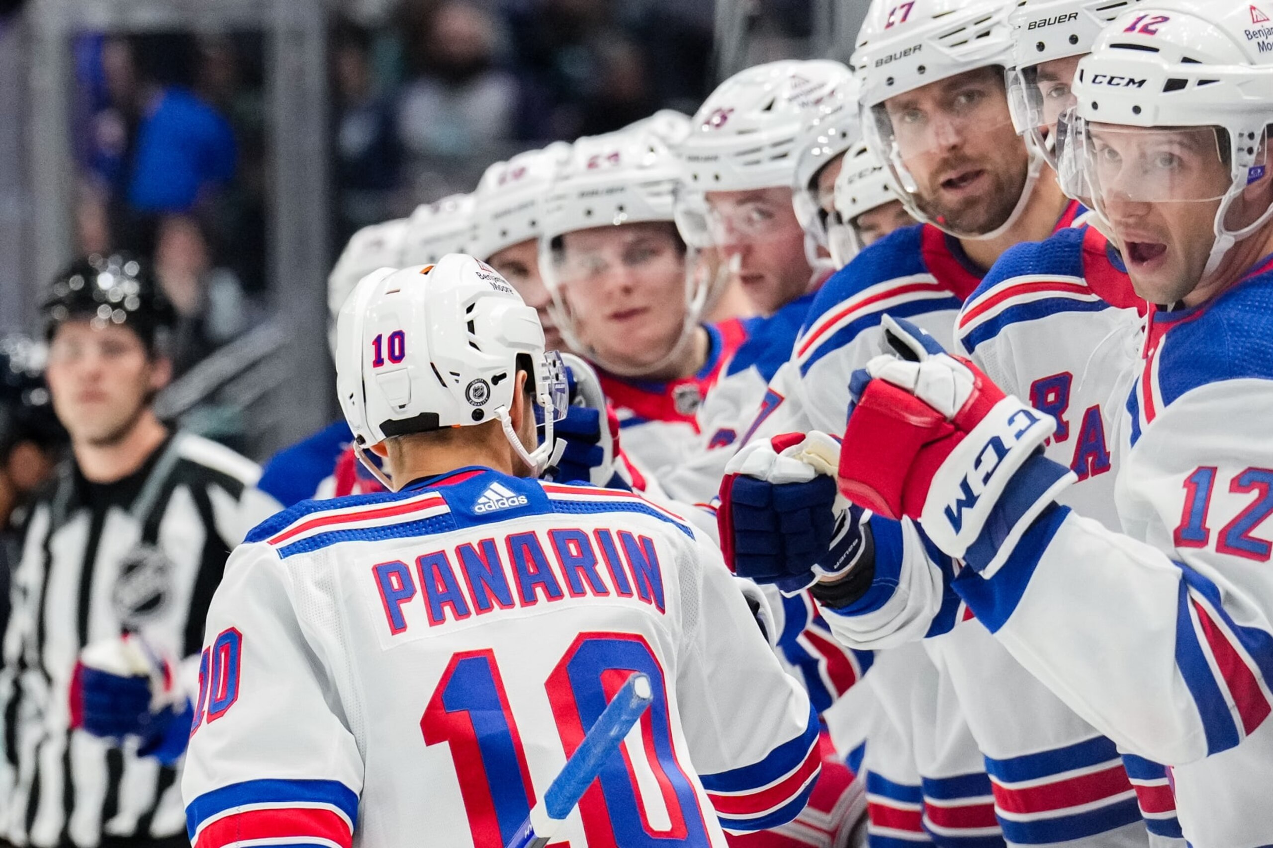 SEATTLE, WASHINGTON - OCTOBER 21: Artemi Panarin #10 of the New York Rangers celebrates with teammates after scoring a goal during the first period of a game against the Seattle Kraken at Climate Pledge Arena on October 21, 2023 in Seattle, Washington. (Photo by Christopher Mast/NHLI via Getty Images)