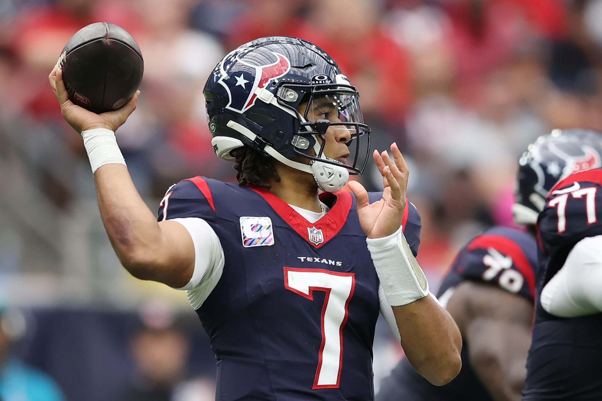 HOUSTON, TEXAS - OCTOBER 15: C.J. Stroud #7 of the Houston Texans throws a pass during the game against the New Orleans Saints at NRG Stadium on October 15, 2023 in Houston, Texas. (Photo by Tim Warner/Getty Images)
