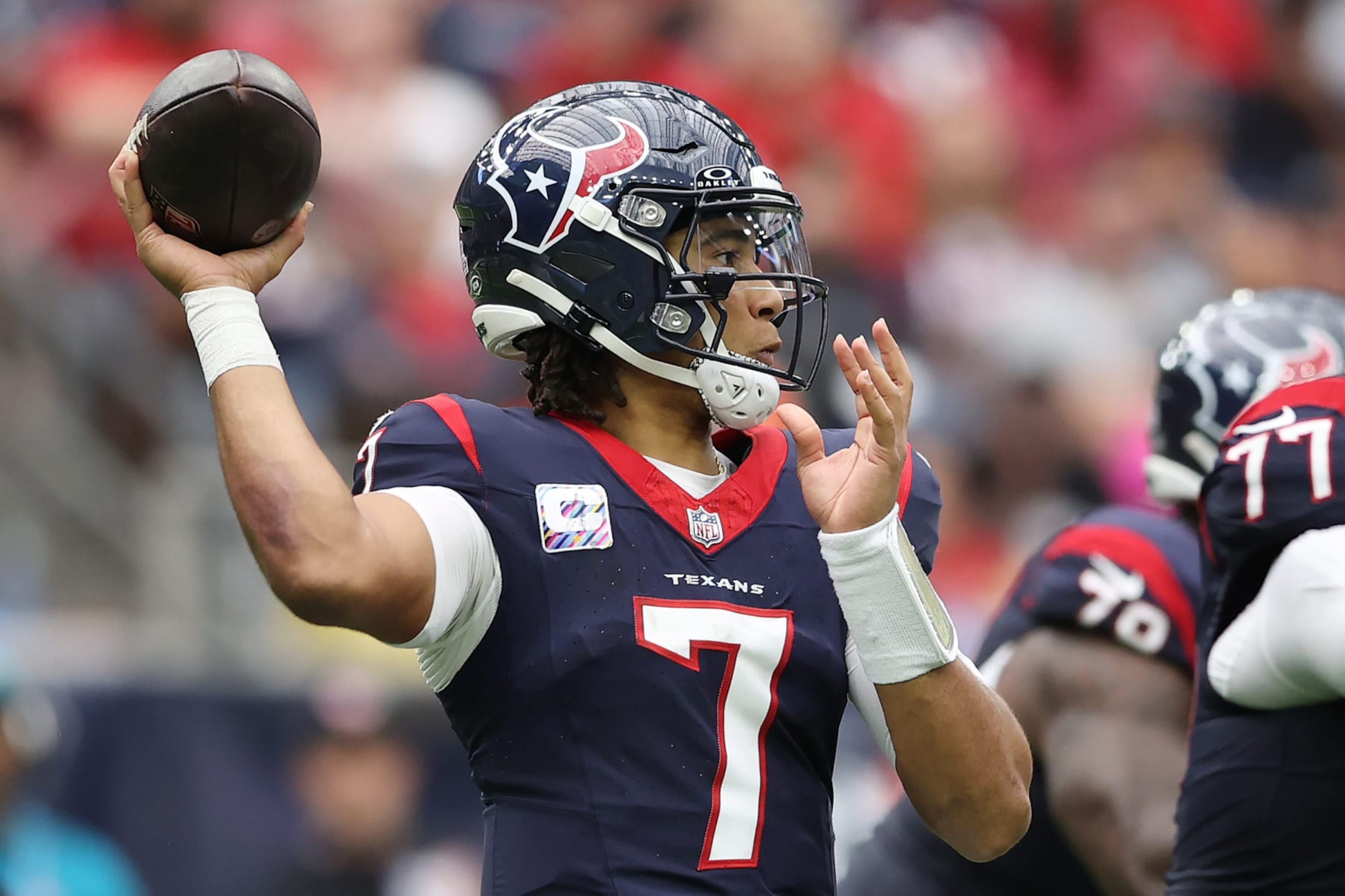 HOUSTON, TEXAS - OCTOBER 15: C.J. Stroud #7 of the Houston Texans throws a pass during the game against the New Orleans Saints at NRG Stadium on October 15, 2023 in Houston, Texas. (Photo by Tim Warner/Getty Images)