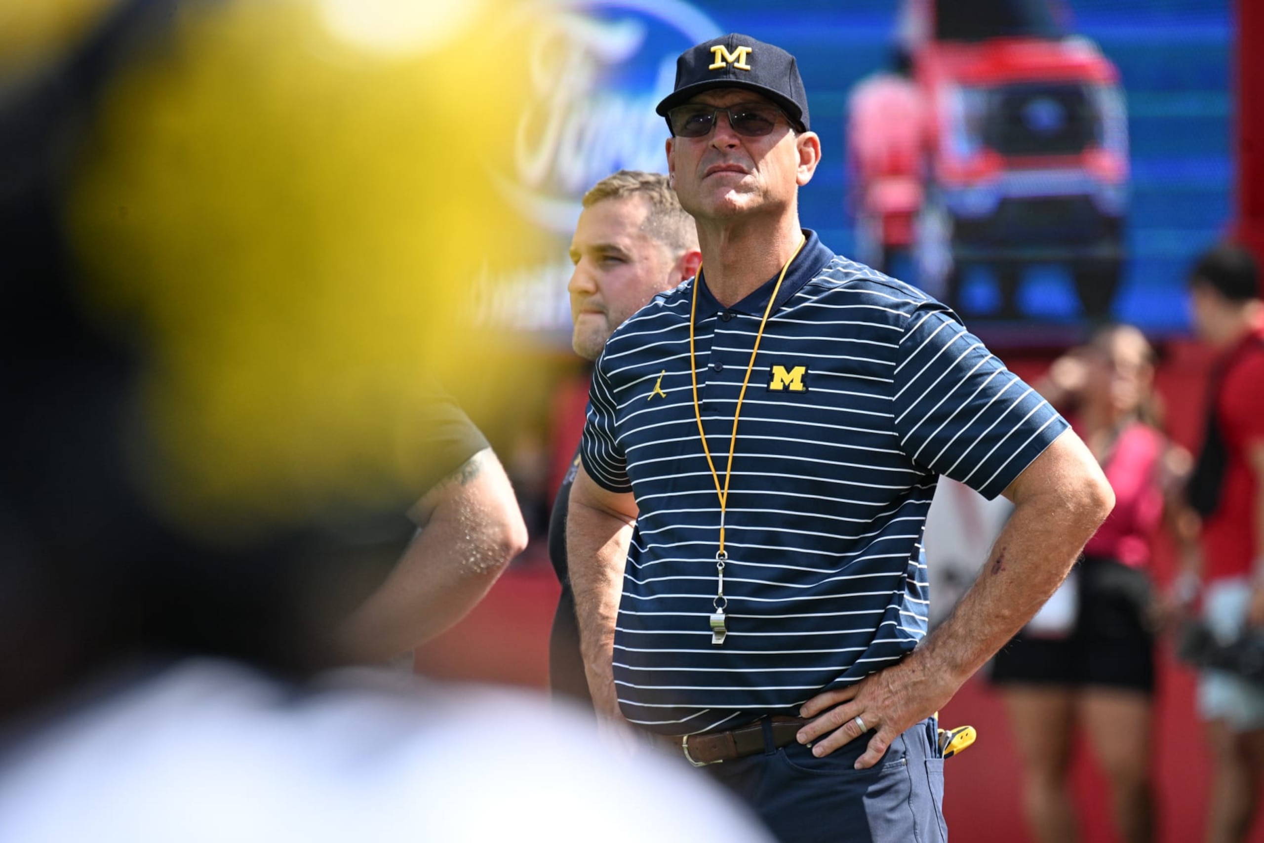 LINCOLN, NEBRASKA - SEPTEMBER 30: Head coach Jim Harbaugh of the Michigan Wolverines watches the team warm up before the game against the Nebraska Cornhuskers at Memorial Stadium on September 30, 2023 in Lincoln, Nebraska. (Photo by Steven Branscombe/Getty Images)