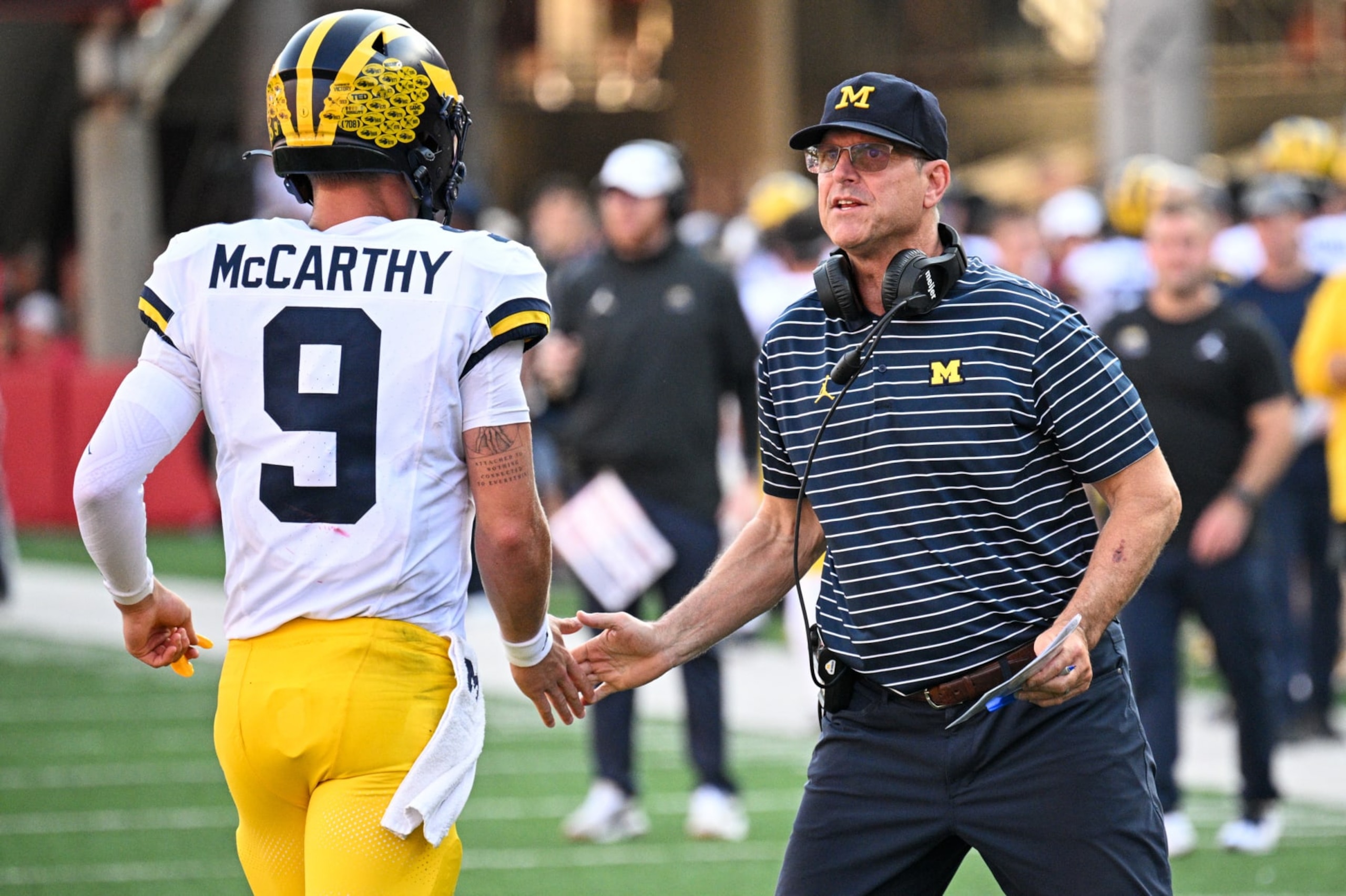 LINCOLN, NEBRASKA - SEPTEMBER 30: Head coach Jim Harbaugh of the Michigan Wolverines greets J.J. McCarthy #9 after a score against the Nebraska Cornhuskers in thethird quarter at Memorial Stadium on September 30, 2023 in Lincoln, Nebraska. (Photo by Steven Branscombe/Getty Images)