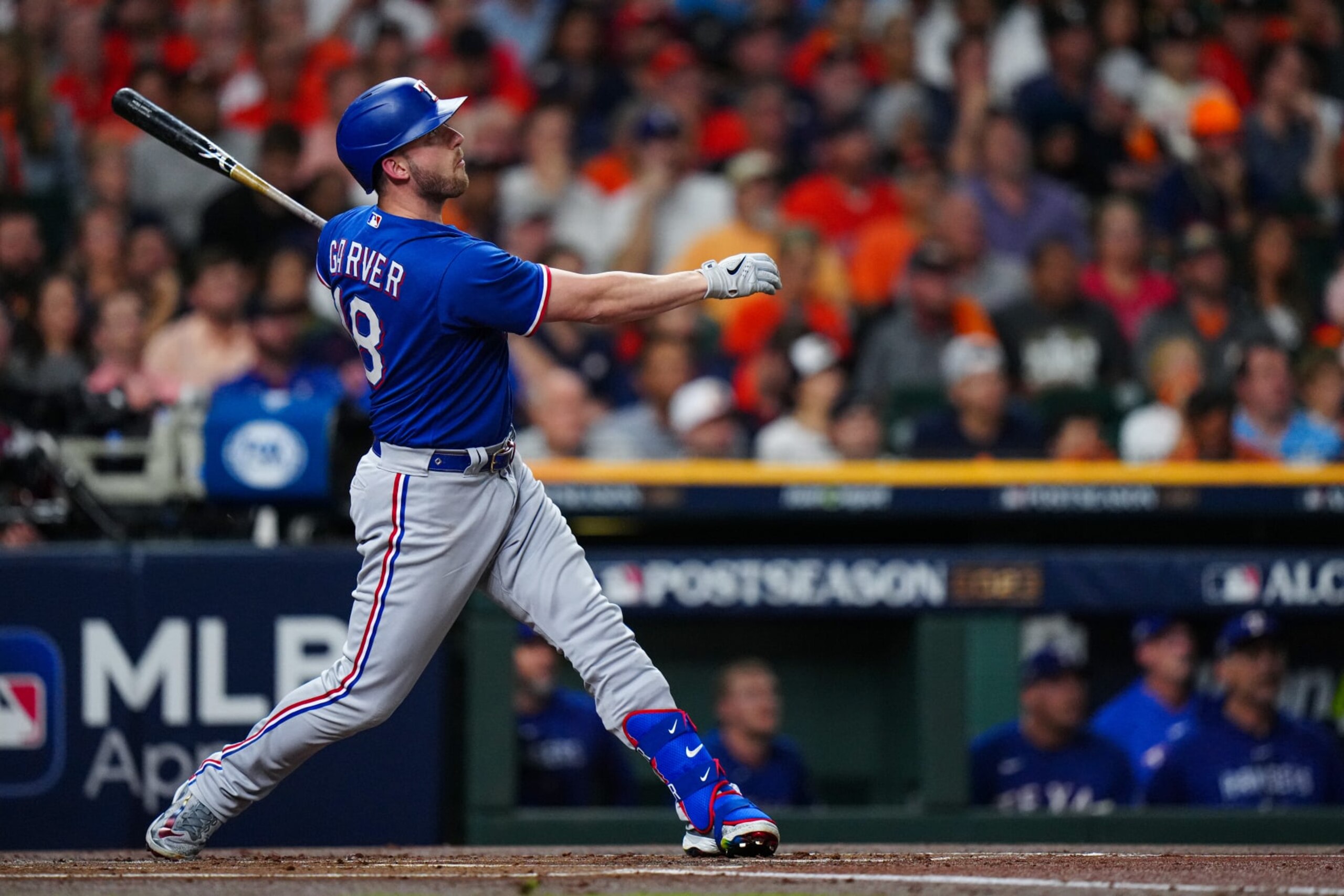 HOUSTON, TX - OCTOBER 23: Mitch Garver #18 of the Texas Rangers hits an RBI single in the first inning of Game 7 of the ALCS between the Texas Rangers and the Houston Astros at Minute Maid Park on Monday, October 23, 2023 in Houston, Texas. (Photo by Daniel Shirey/MLB Photos via Getty Images)