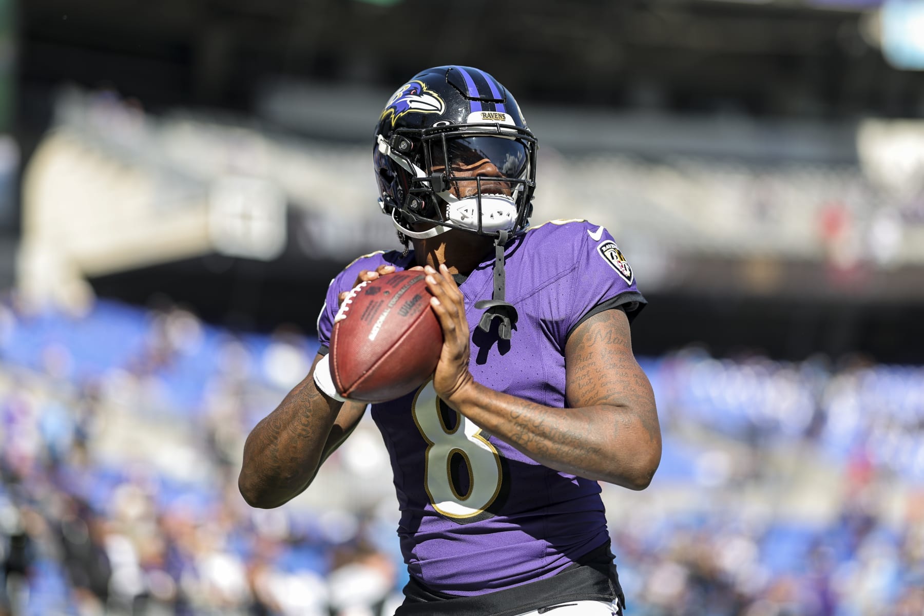 BALTIMORE, MARYLAND - OCTOBER 22: Lamar Jackson #8 of the Baltimore Ravens passes as he warms up prior to an NFL football game between the Baltimore Ravens and the Detroit Lions at M&T Bank Stadium on October 22, 2023 in Baltimore, Maryland. (Photo by Michael Owens/Getty Images)