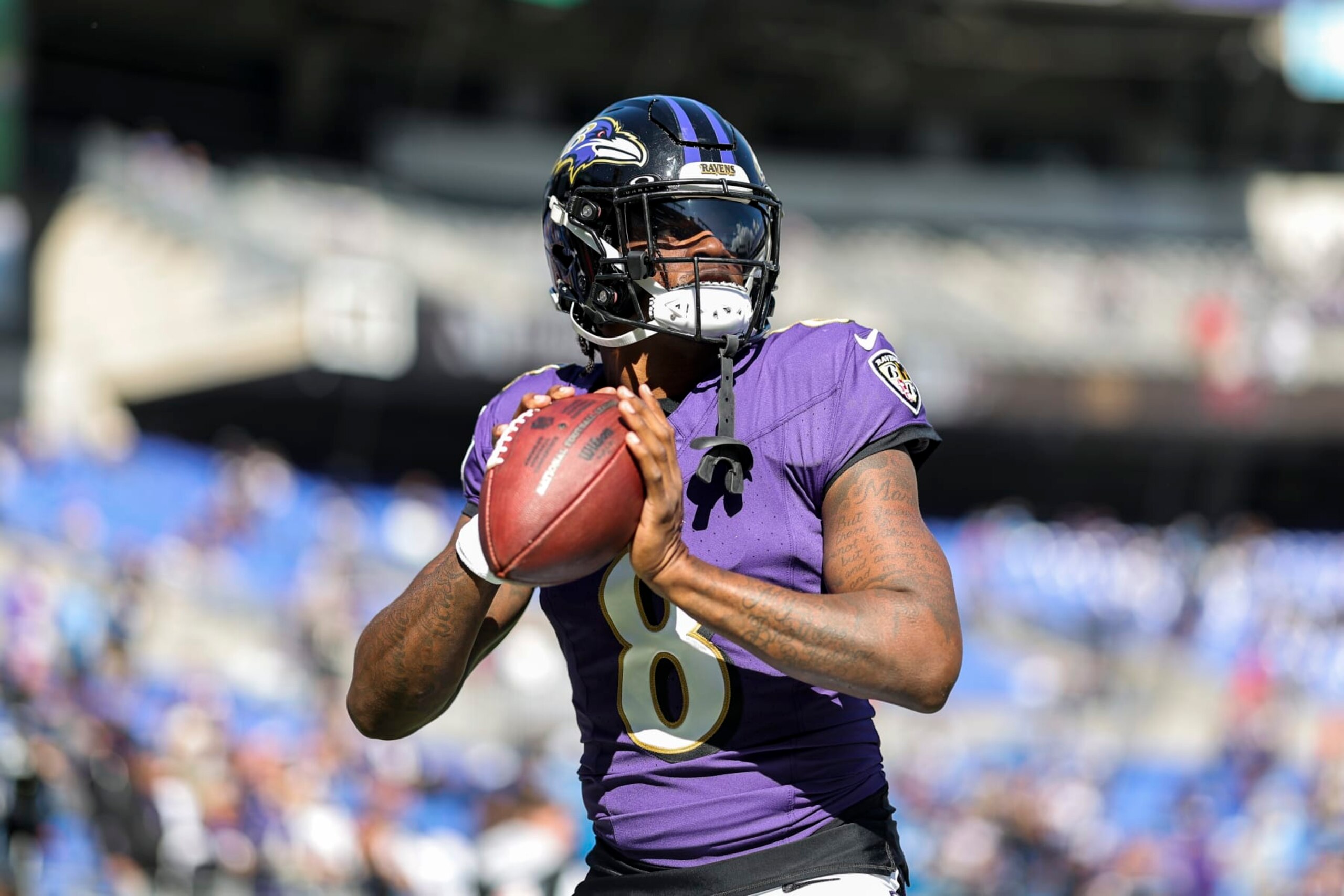BALTIMORE, MARYLAND - OCTOBER 22: Lamar Jackson #8 of the Baltimore Ravens passes as he warms up prior to an NFL football game between the Baltimore Ravens and the Detroit Lions at M&T Bank Stadium on October 22, 2023 in Baltimore, Maryland. (Photo by Michael Owens/Getty Images)