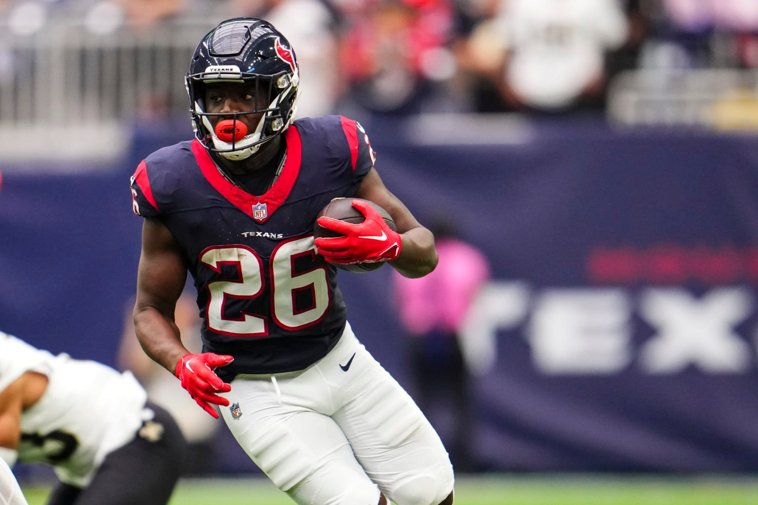 HOUSTON, TX - OCTOBER 15: Devin Singletary #26 of the Houston Texans runs the ball during an NFL football game against the New Orleans Saints at NRG Stadium on October 15, 2023 in Houston, Texas. (Photo by Cooper Neill/Getty Images)