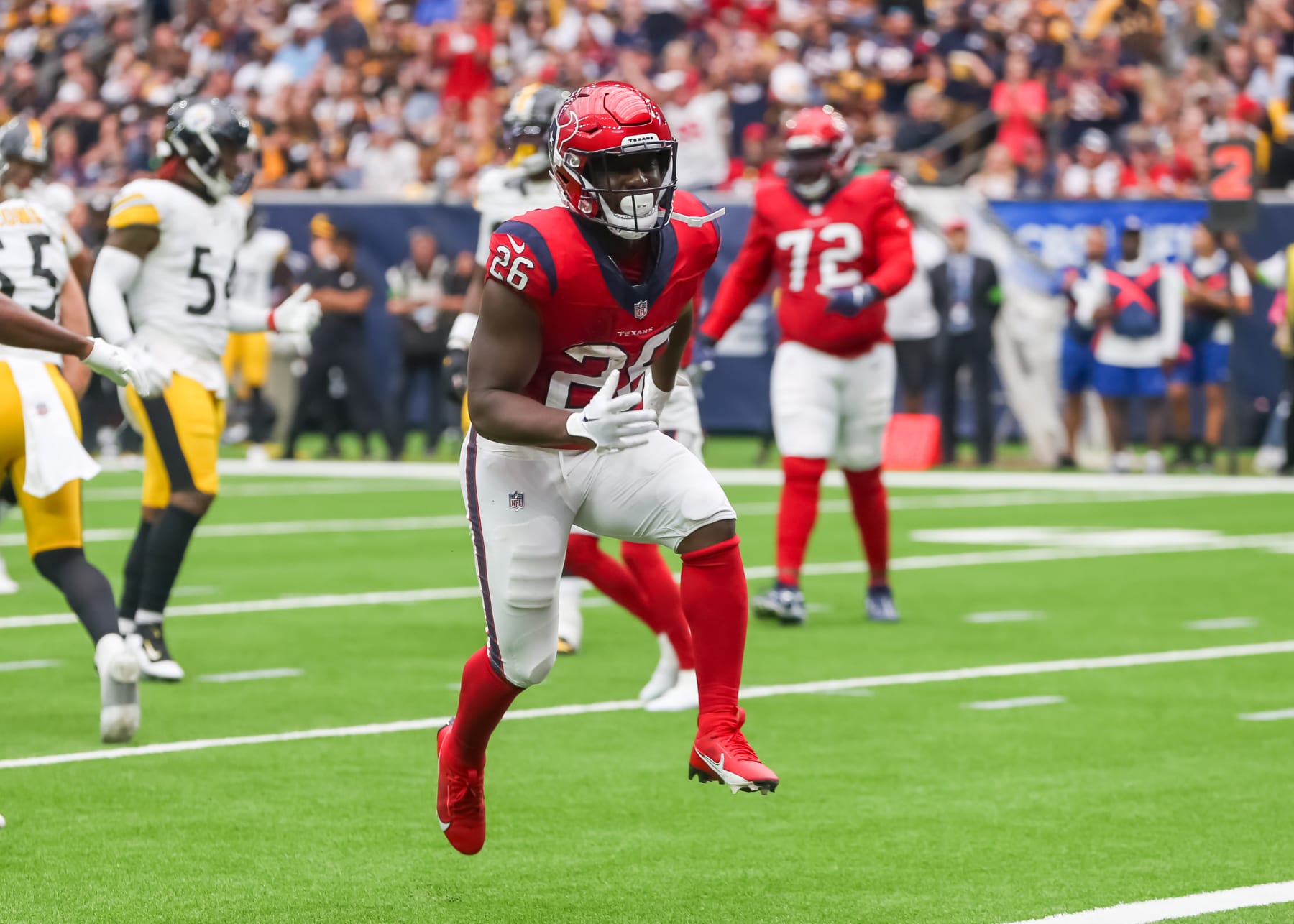 HOUSTON, TX - OCTOBER 01:  Houston Texans running back Devin Singletary (26) celebrates his ball carry in the fourth quarter during the NFL game between the Pittsburgh Steelers and Houston Texans on October 1, 2023 at NRG Stadium in Houston, Texas.  (Photo by Leslie Plaza Johnson/Icon Sportswire via Getty Images)