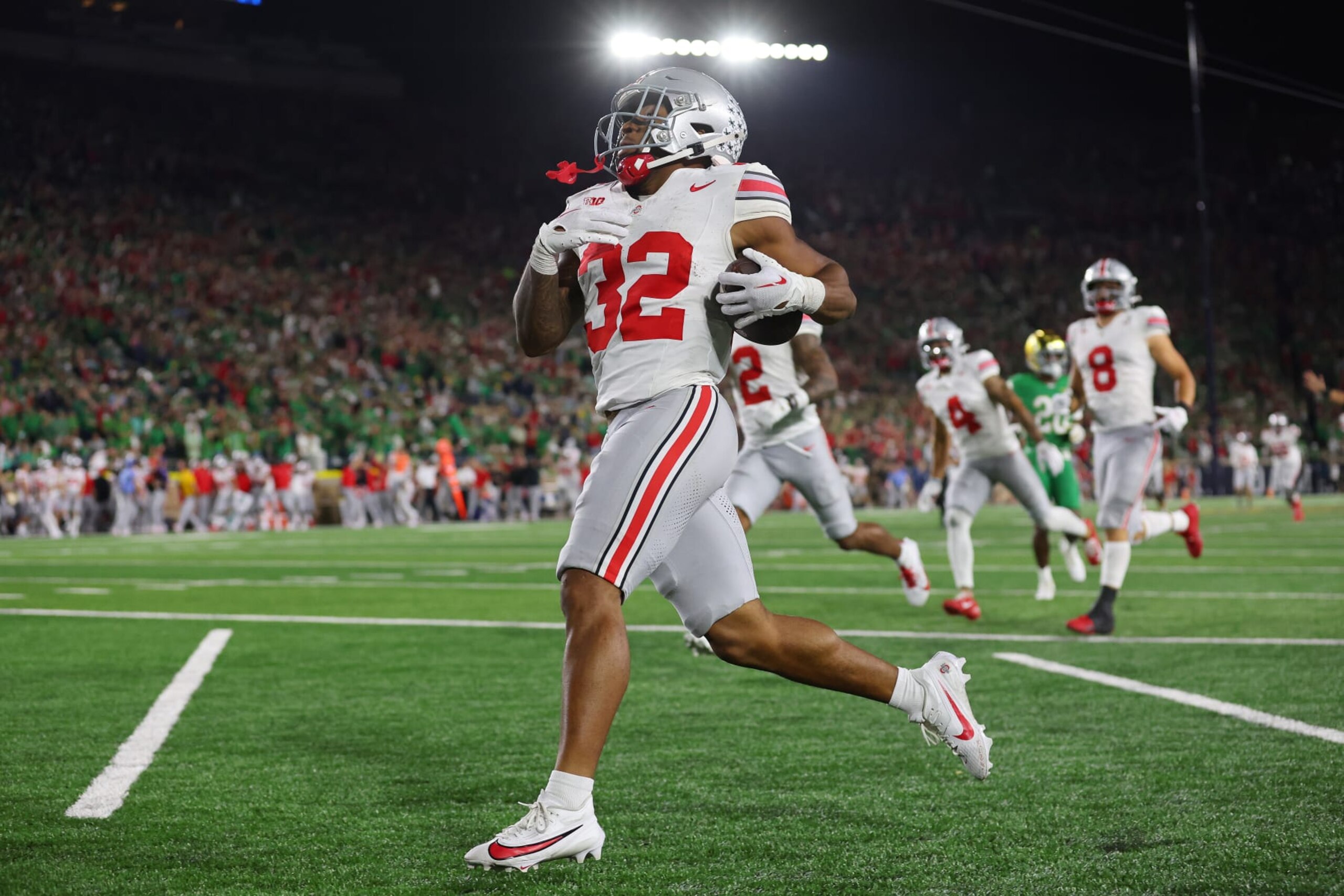 SOUTH BEND, INDIANA - SEPTEMBER 23: TreVeyon Henderson #32 of the Ohio State Buckeyes celebrates after running for atouchdown during the third quarter against the Notre Dame Fighting Irish at Notre Dame Stadium on September 23, 2023 in South Bend, Indiana. (Photo by Michael Reaves/Getty Images)