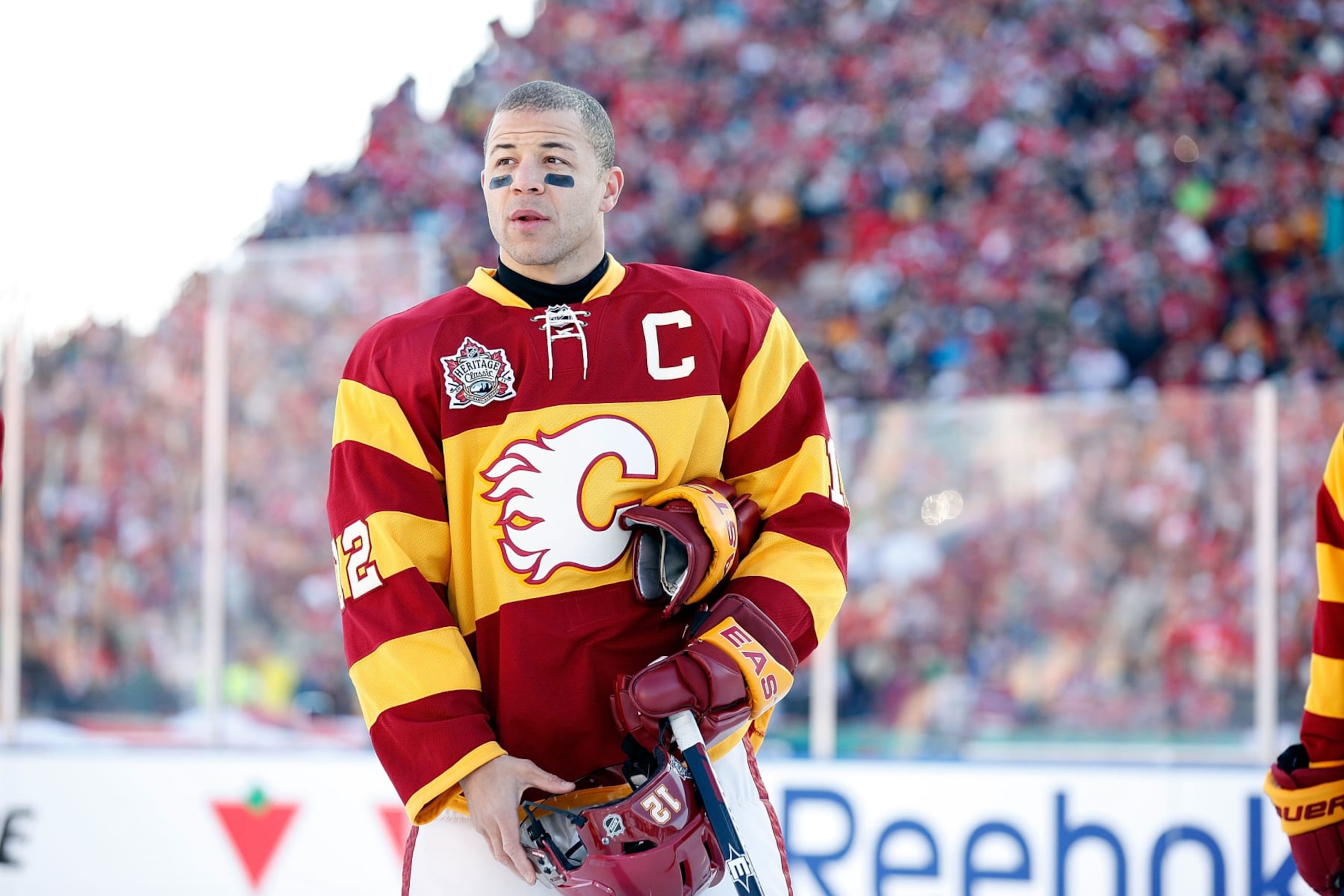 CALGARY, CANADA - FEBRUARY 20: Jarome Iginla #12 of the Calgary Flames stands during the pre-game ceremonies before the game against the Montreal Canadiens on February 20, 2011 during the 2011 Heritage Classic at McMahon Stadium in Calgary, Alberta, Canada. The Flames won 4-0. (Photo by Gerry Thomas/NHLI via Getty Images) CALGARY, CANADA - FEBRUARY 20: Jarome Iginla #12 of the Calgary Flames stands during the pre-game ceremonies before the game against the Montreal Canadiens on February 20, 2011 during the 2011 Heritage Classic at McMahon Stadium in Calgary, Alberta, Canada. The Flames won 4-0. (Photo by Gerry Thomas/NHLI via Getty Images)