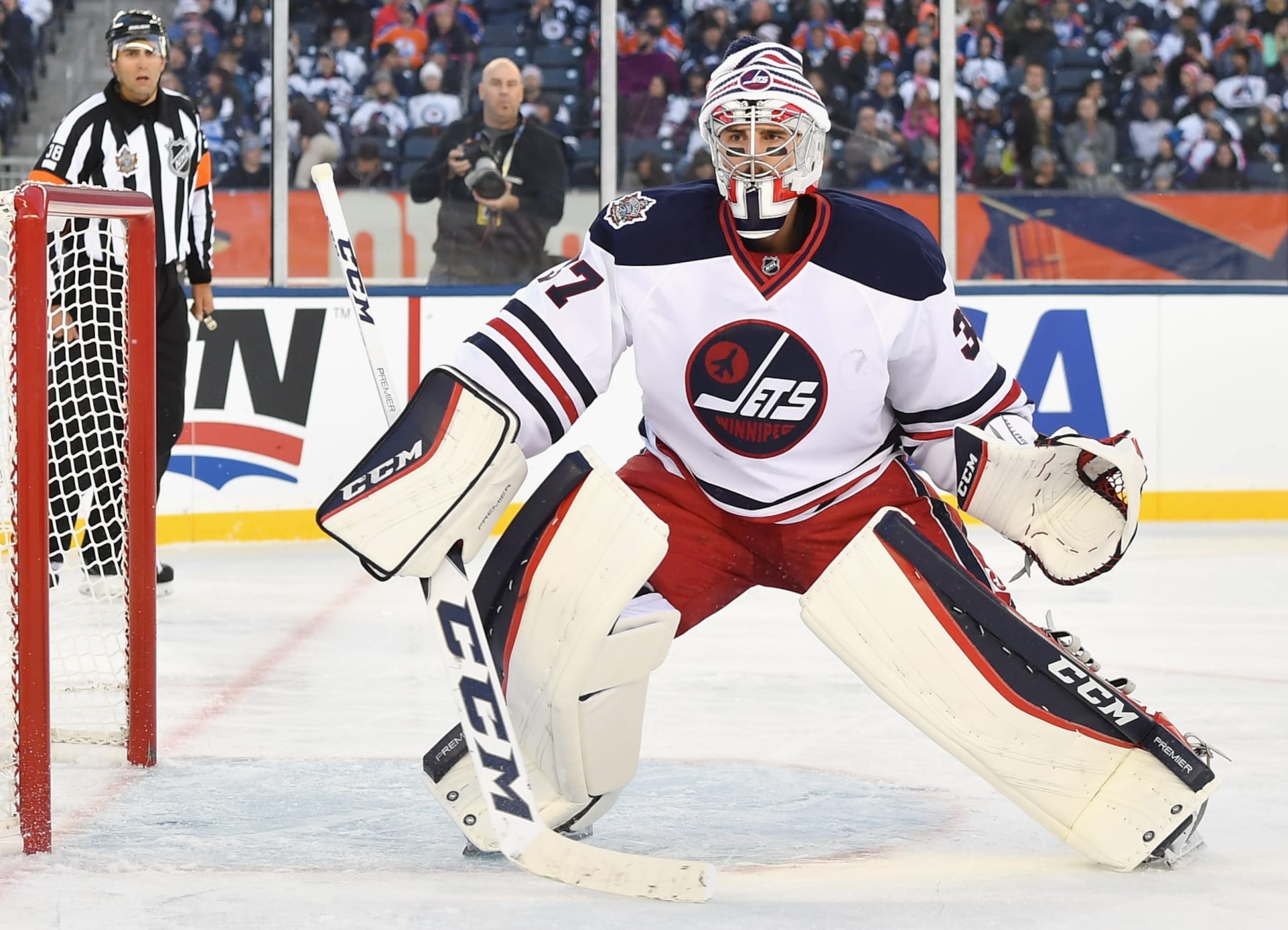 WINNIPEG, MB - OCTOBER 23: Goaltender Connor Hellebuyck #37 of the Winnipeg Jets plays in the 2016 Tim Hortons NHL Heritage Classic against the Edmonton Oilers at Investors Group Field on October 23, 2016 in Winnipeg, Canada. (Photo by Andy Devlin/NHLI via Getty Images) WINNIPEG, MB - OCTOBER 23: Goaltender Connor Hellebuyck #37 of the Winnipeg Jets plays in the 2016 Tim Hortons NHL Heritage Classic against the Edmonton Oilers at Investors Group Field on October 23, 2016 in Winnipeg, Canada. (Photo by Andy Devlin/NHLI via Getty Images)