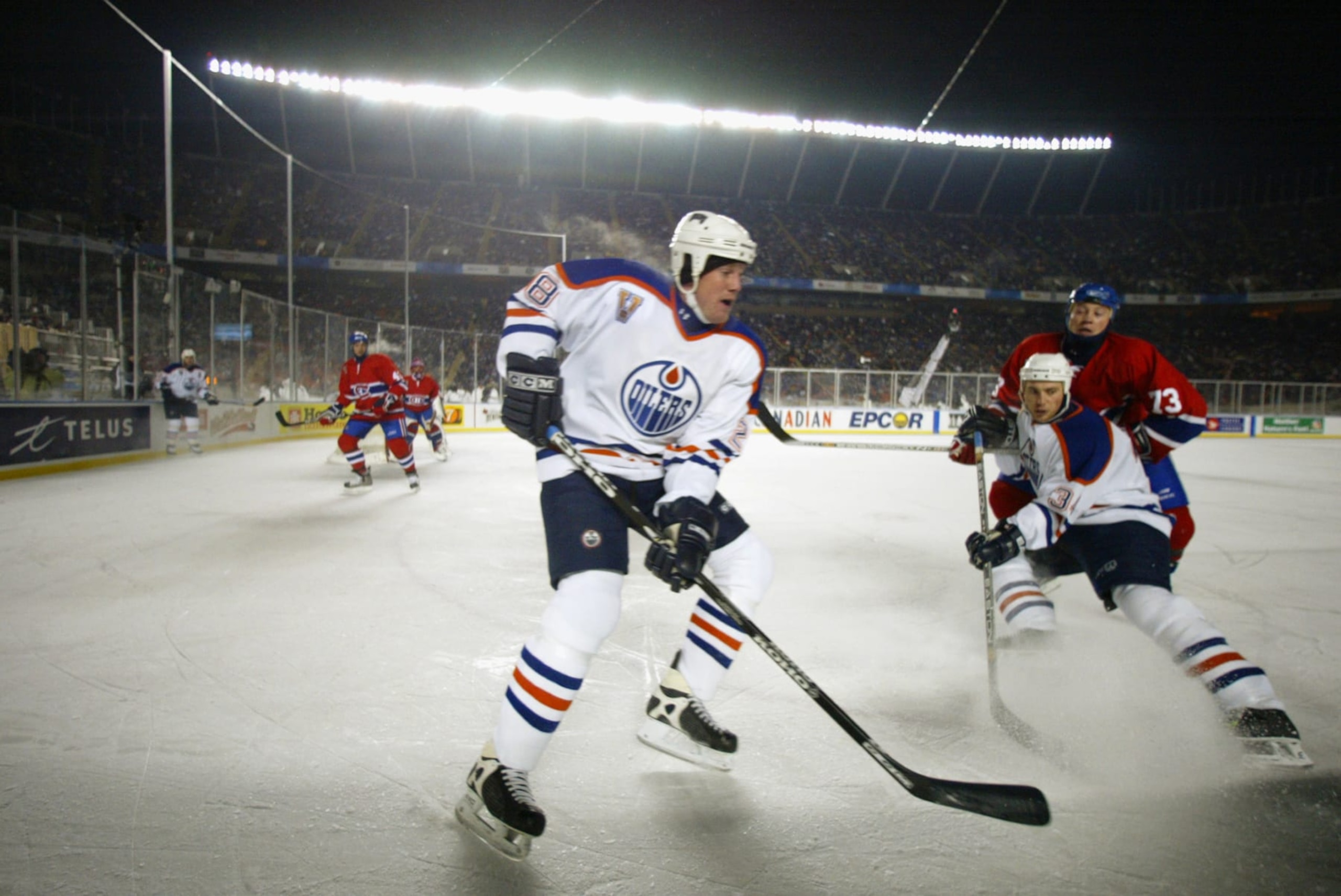 EDMONTON, CAN - NOVEMBER 22: Left wing Jason Chimera #28 and right wing Fernando Pisani #34 of the Edmonton Oilers skate toward the puck during the game against the Montreal Canadiens in the Molson Canadien Heritage Classic on November 22, 2003 at Commonwealth Stadium in Edmonton, Canada. An NHL-record crowd of 57,167 braved temperatures hitting -20 Celsius at game time to watch the Canadiens edge the Oilers 4-3. Photo by Jeff Vinnick/Getty Images) EDMONTON, CAN - NOVEMBER 22: Left wing Jason Chimera #28 and right wing Fernando Pisani #34 of the Edmonton Oilers skate toward the puck during the game against the Montreal Canadiens in the Molson Canadien Heritage Classic on November 22, 2003 at Commonwealth Stadium in Edmonton, Canada. An NHL-record crowd of 57,167 braved temperatures hitting -20 Celsius at game time to watch the Canadiens edge the Oilers 4-3. Photo by Jeff Vinnick/Getty Images)
