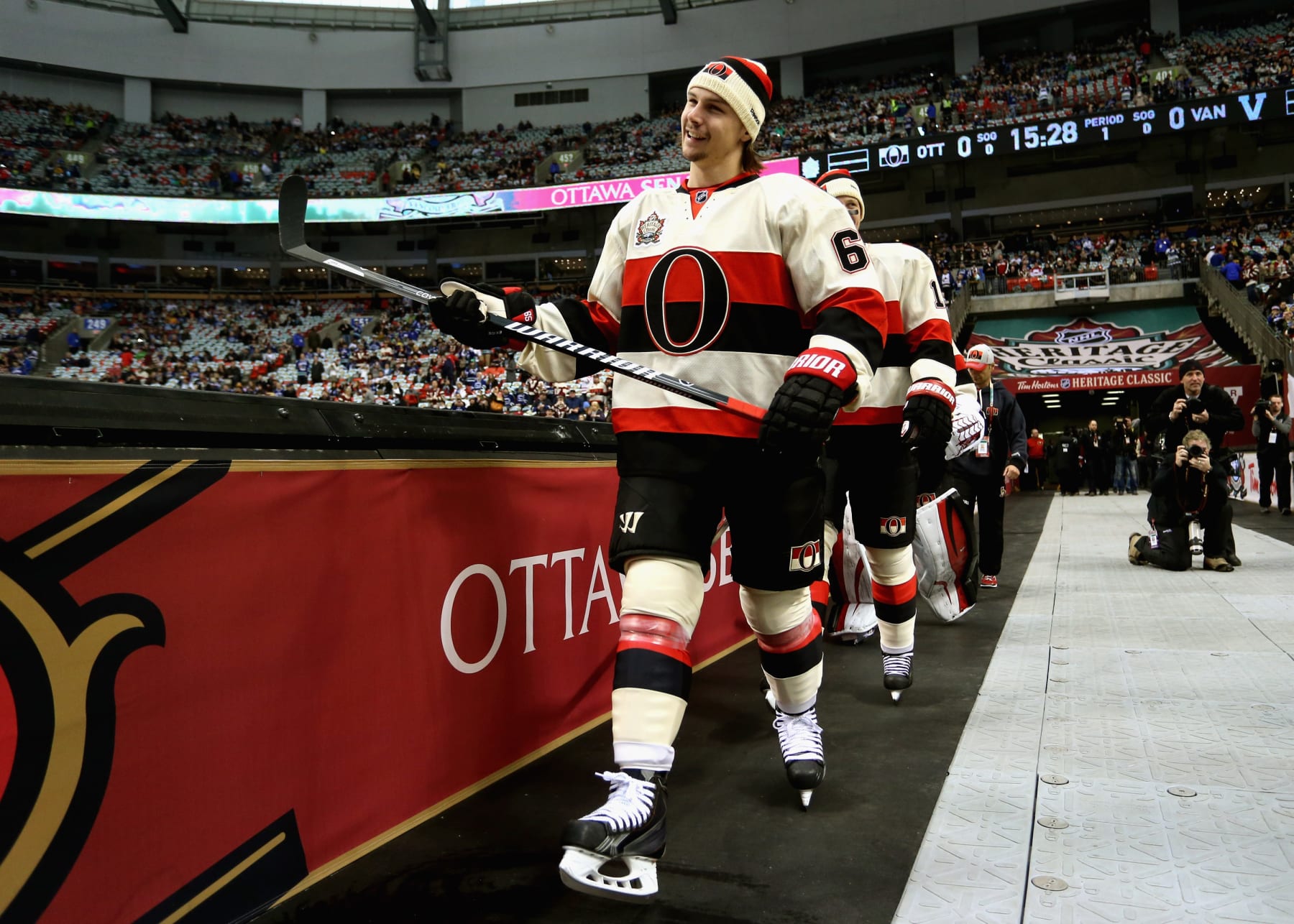VANCOUVER, BC - MARCH 02:  (EDITORIAL USE ONLY) Erik Karlsson #65 of the Ottawa Senators walks out before playing the Vancouver Canucks during the 2014 Tim Hortons NHL Heritage Classic game at BC Place on March 2, 2014 in Vancouver, British Columbia, Canada.  (Photo by Andre Ringuette/NHLI via Getty Images) 