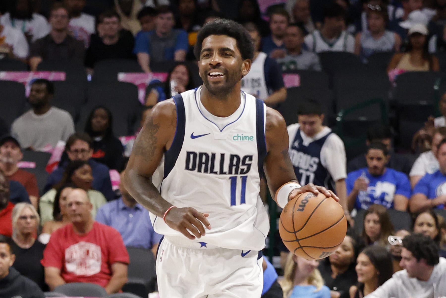 Dallas Mavericks guard Kyrie Irving (11) advances the ball during the first half of an NBA preseason basketball gam in Dallas, Friday, Oct. 20, 2023. (AP Photo/Michael Ainsworth)