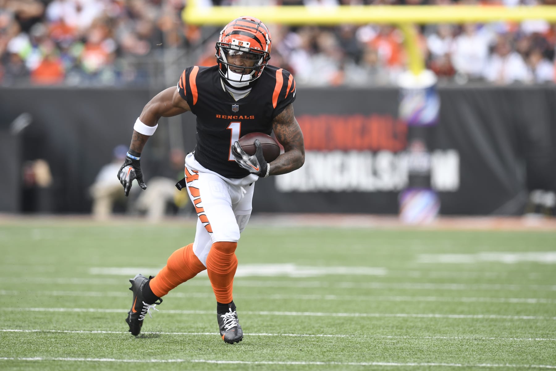 CINCINNATI, OH - OCTOBER 15: Cincinnati Bengals Wide Receiver Ja'Marr Chase (1) advances the ball during the NFL game between the Seattle Seahawks and the Cincinnati Bengals on October 15, 2023, at Paycor Stadium in Cincinnati, Ohio. (Photo by Michael Allio/Icon Sportswire via Getty Images)