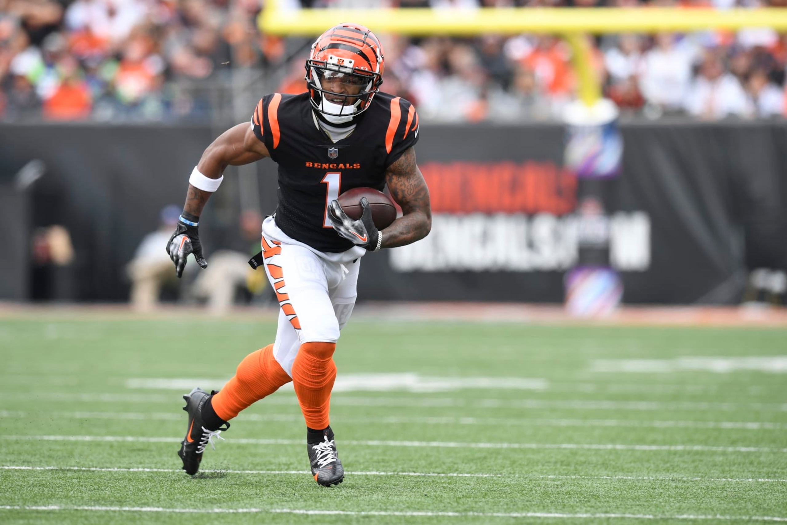 CINCINNATI, OH - OCTOBER 15: Cincinnati Bengals Wide Receiver Ja'Marr Chase (1) advances the ball during the NFL game between the Seattle Seahawks and the Cincinnati Bengals on October 15, 2023, at Paycor Stadium in Cincinnati, Ohio. (Photo by Michael Allio/Icon Sportswire via Getty Images)