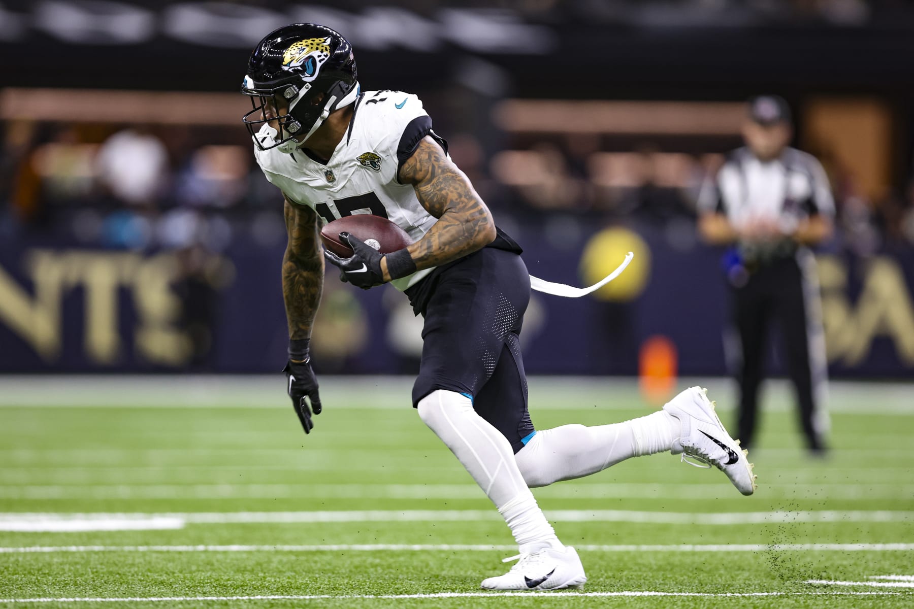 NEW ORLEANS, LA - OCTOBER 19: Evan Engram #17 of the Jacksonville Jaguars runs the ball during an NFL football game against the New Orleans Saints at Caesars Superdome on October 19, 2023 in New Orleans, Louisiana. (Photo by Perry Knotts/Getty Images)