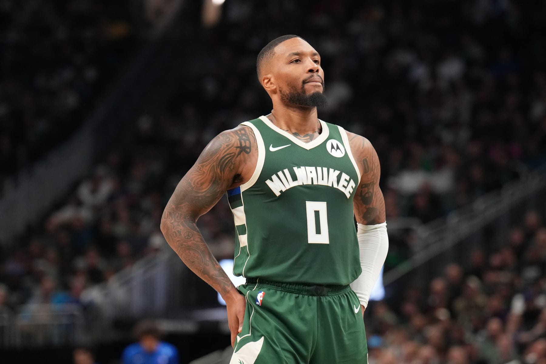MILWAUKEE, WI - OCTOBER 26: Damian Lillard #0 of the Milwaukee Bucks looks on during the game against the Philadelphia 76ers on October 26, 2023 at the Fiserv Forum Center in Milwaukee, Wisconsin. NOTE TO USER: User expressly acknowledges and agrees that, by downloading and or using this Photograph, user is consenting to the terms and conditions of the Getty Images License Agreement. Mandatory Copyright Notice: Copyright 2023 NBAE (Photo by Jesse D. Garrabrant/NBAE via Getty Images).
