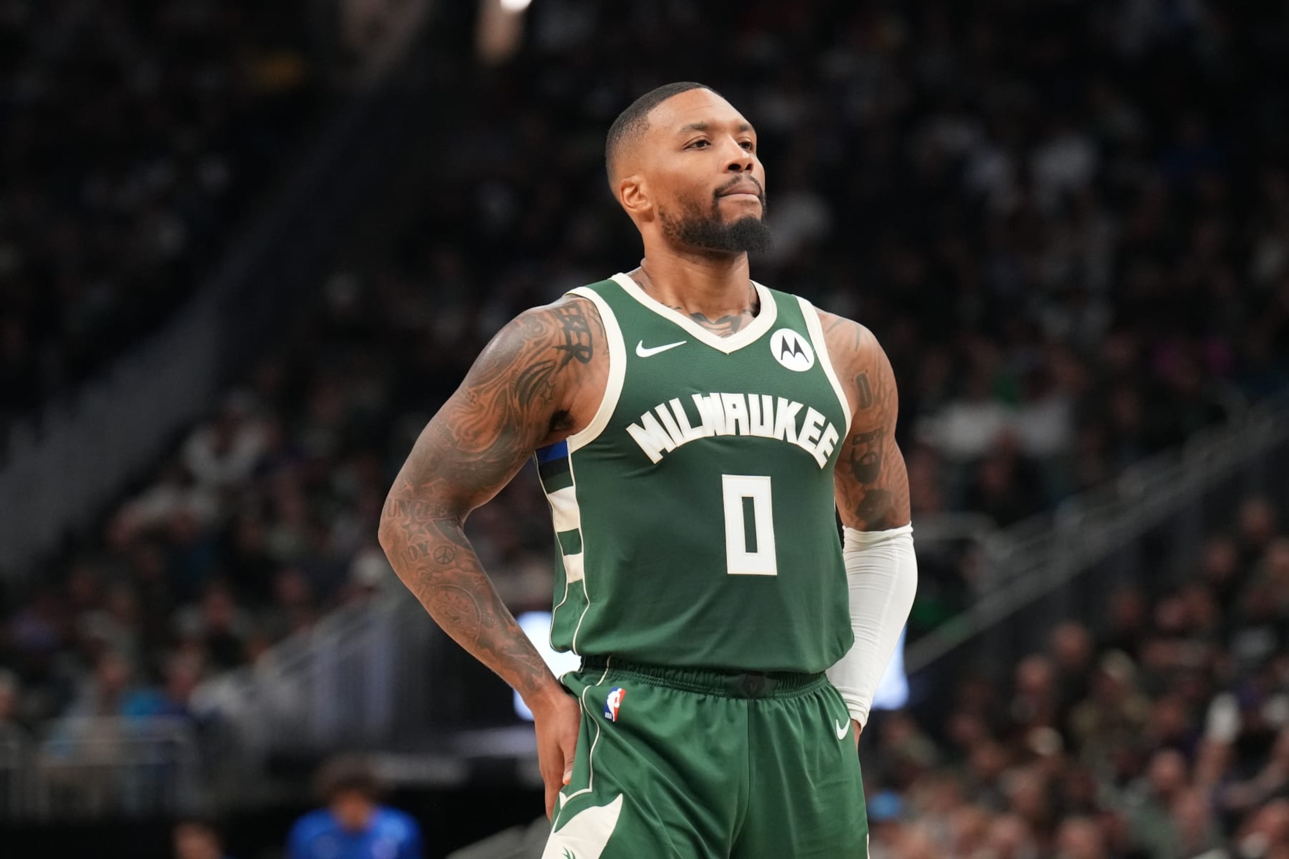 MILWAUKEE, WI - OCTOBER 26: Damian Lillard #0 of the Milwaukee Bucks looks on during the game against the Philadelphia 76ers on October 26, 2023 at the Fiserv Forum Center in Milwaukee, Wisconsin. NOTE TO USER: User expressly acknowledges and agrees that, by downloading and or using this Photograph, user is consenting to the terms and conditions of the Getty Images License Agreement. Mandatory Copyright Notice: Copyright 2023 NBAE (Photo by Jesse D. Garrabrant/NBAE via Getty Images). MILWAUKEE, WI - OCTOBER 26: Damian Lillard #0 of the Milwaukee Bucks looks on during the game against the Philadelphia 76ers on October 26, 2023 at the Fiserv Forum Center in Milwaukee, Wisconsin. NOTE TO USER: User expressly acknowledges and agrees that, by downloading and or using this Photograph, user is consenting to the terms and conditions of the Getty Images License Agreement. Mandatory Copyright Notice: Copyright 2023 NBAE (Photo by Jesse D. Garrabrant/NBAE via Getty Images).
