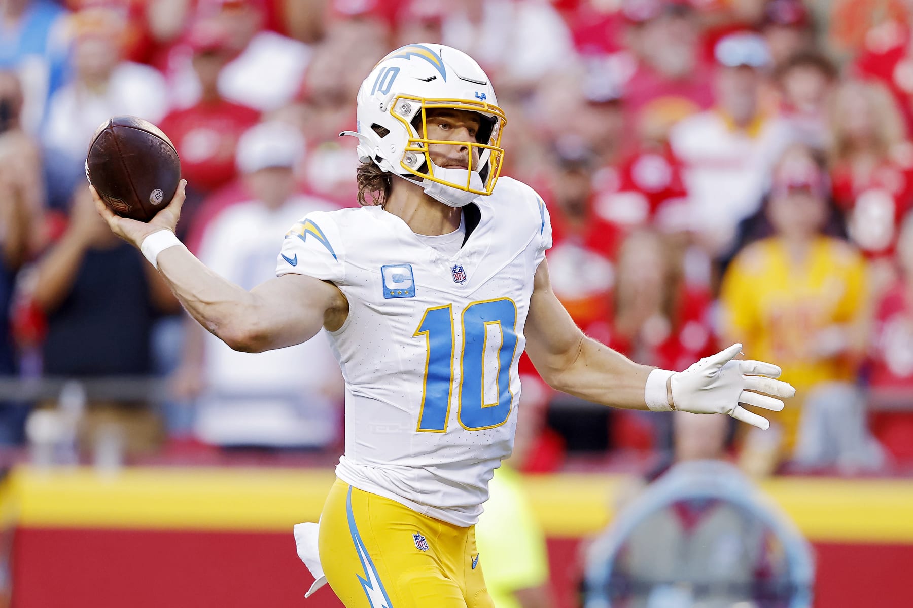 KANSAS CITY, MISSOURI - OCTOBER 22: Justin Herbert #10 of the Los Angeles Chargers throws a pass during the second half against the Kansas City Chiefs at GEHA Field at Arrowhead Stadium on October 22, 2023 in Kansas City, Missouri. (Photo by David Eulitt/Getty Images)
