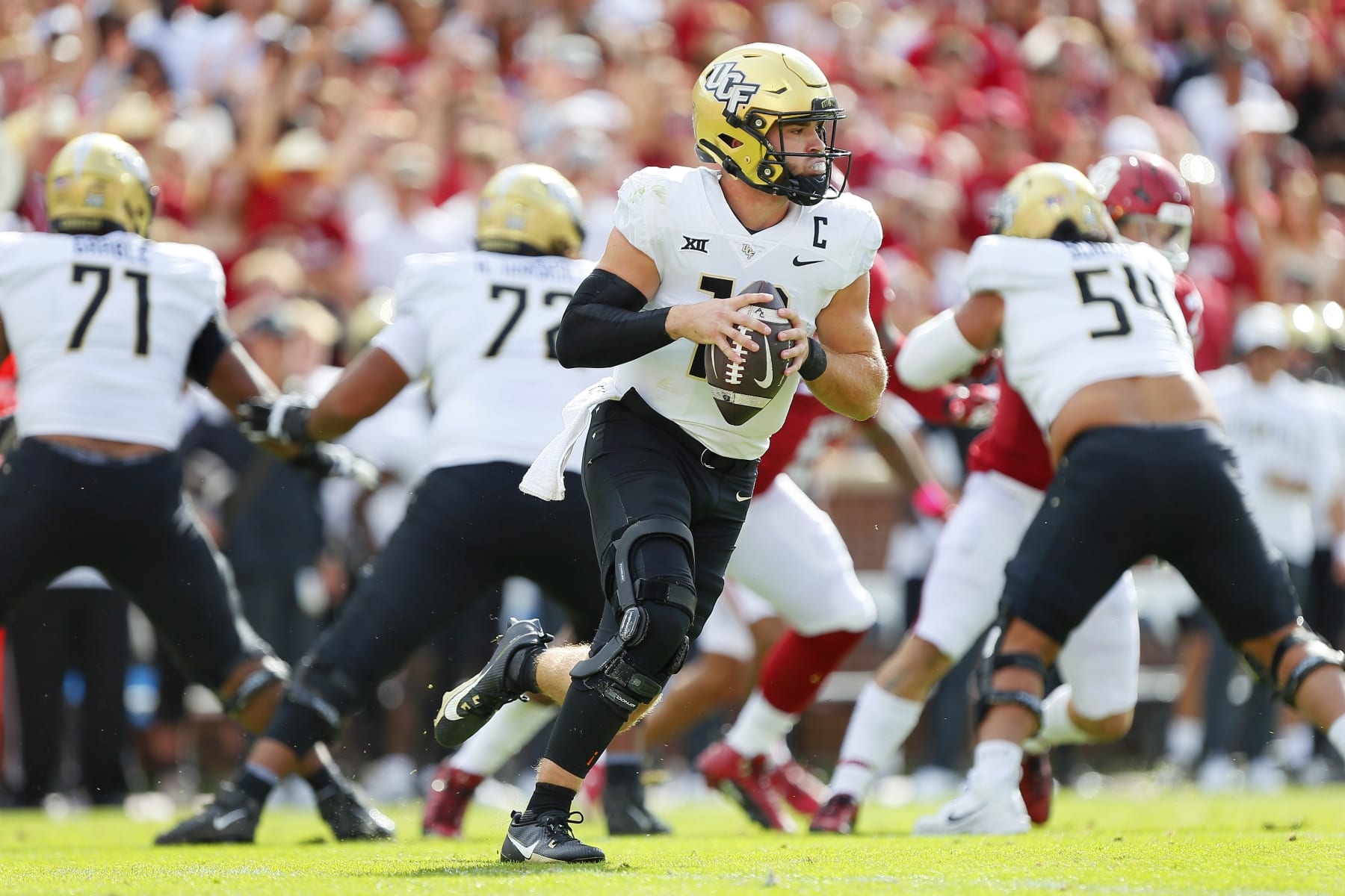 NORMAN, OKLAHOMA - OCTOBER 21:  Quarterback John Rhys Plumlee #10 of the UCF Knights looks to throw against the Oklahoma Sooners in the first quarter at Gaylord Family Oklahoma Memorial Stadium on October 21, 2023 in Norman, Oklahoma.  Oklahoma won 31-29.  (Photo by Brian Bahr/Getty Images)