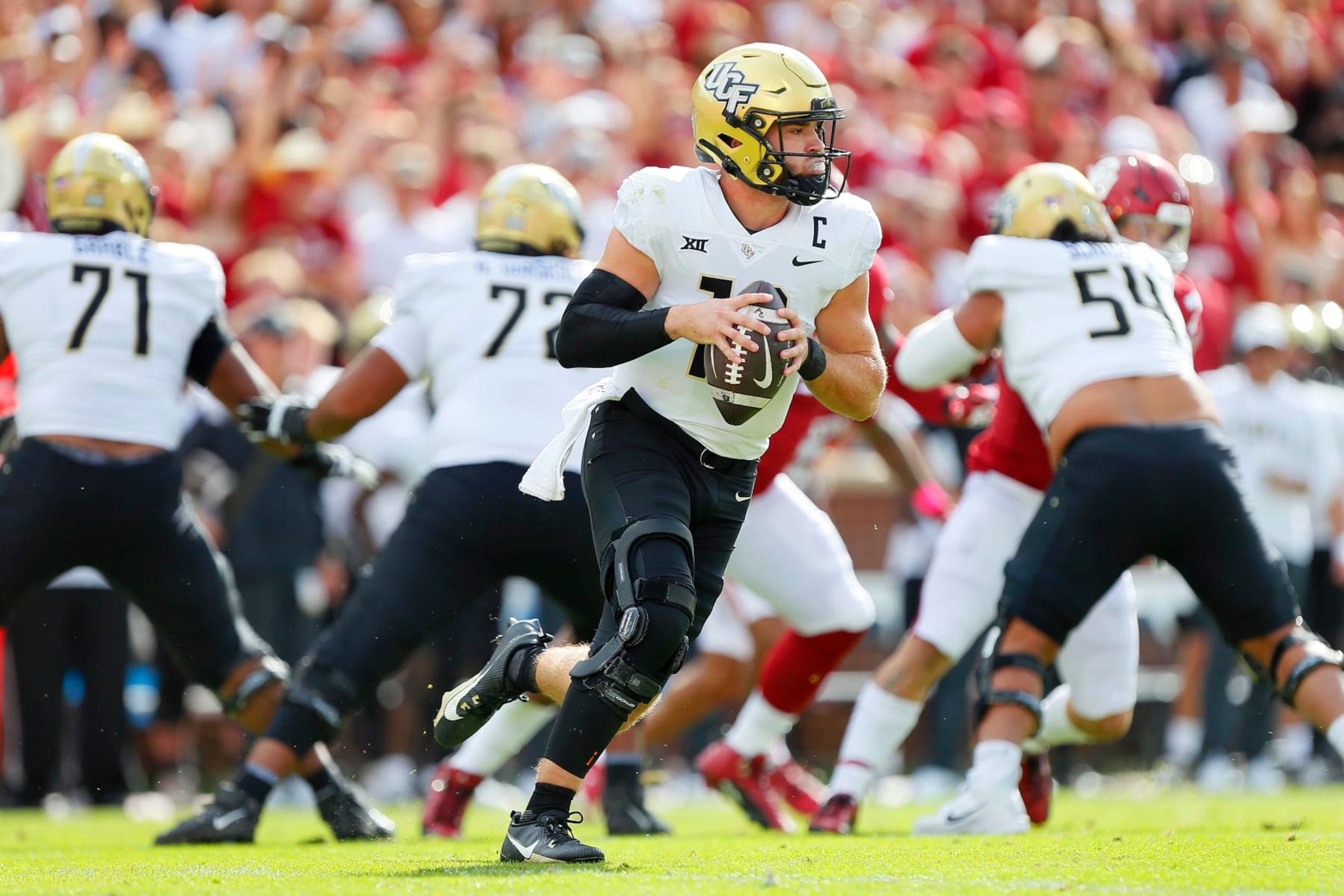 NORMAN, OKLAHOMA - OCTOBER 21:  Quarterback John Rhys Plumlee #10 of the UCF Knights looks to throw against the Oklahoma Sooners in the first quarter at Gaylord Family Oklahoma Memorial Stadium on October 21, 2023 in Norman, Oklahoma.  Oklahoma won 31-29.  (Photo by Brian Bahr/Getty Images)