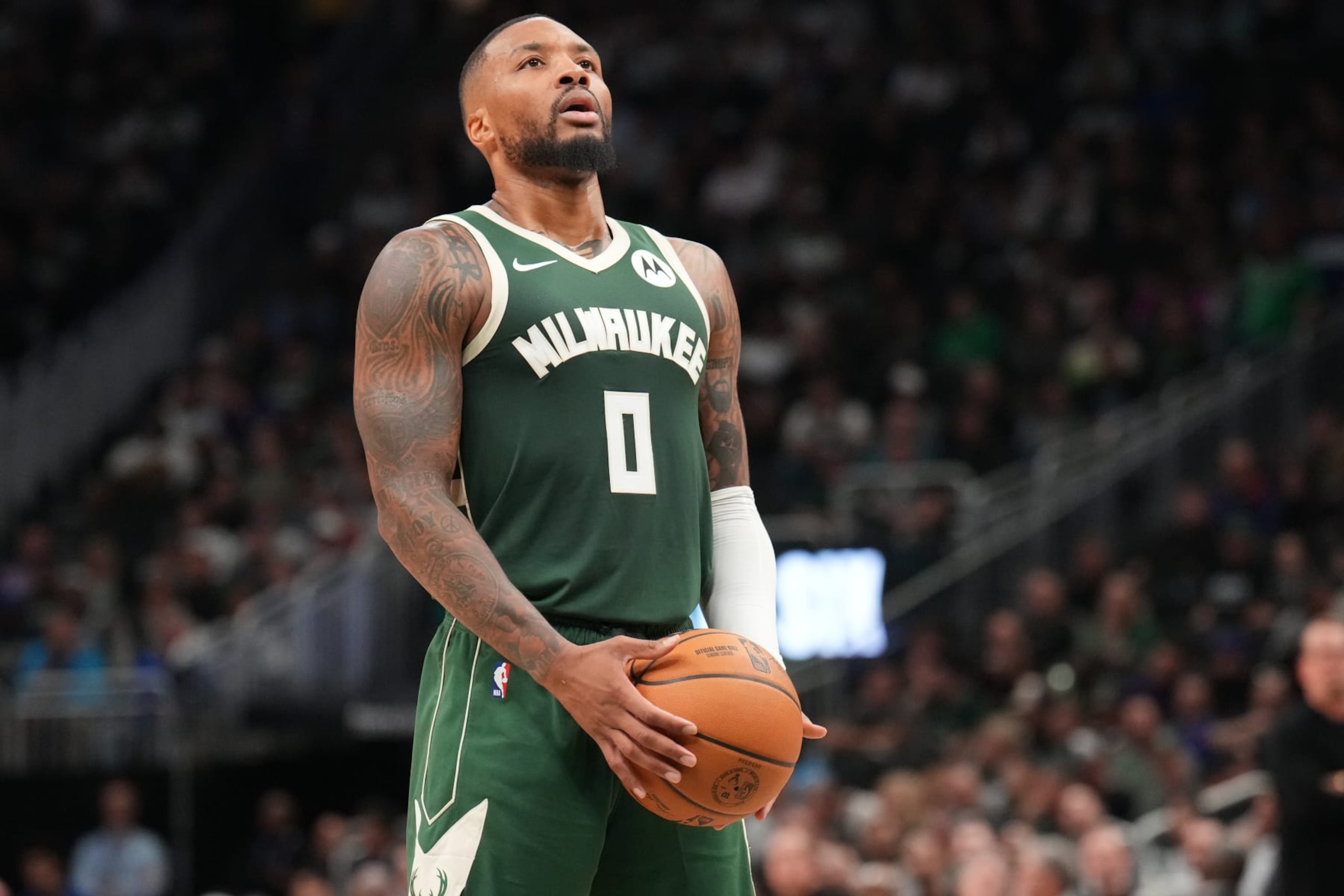 MILWAUKEE, WI - OCTOBER 26: Damian Lillard #0 of the Milwaukee Bucks shoots a free throw during the game against the Philadelphia 76ers on October 26, 2023 at the Fiserv Forum Center in Milwaukee, Wisconsin. NOTE TO USER: User expressly acknowledges and agrees that, by downloading and or using this Photograph, user is consenting to the terms and conditions of the Getty Images License Agreement. Mandatory Copyright Notice: Copyright 2023 NBAE (Photo by Jesse D. Garrabrant/NBAE via Getty Images).
