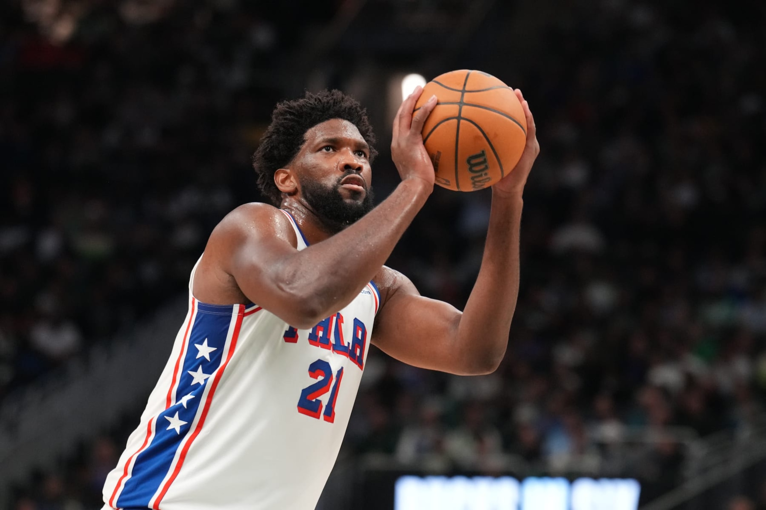 MILWAUKEE, WI - OCTOBER 26: Joel Embiid #21 of the Philadelphia 76ers shoots a free throw during the game against the Milwaukee Bucks on October 26, 2023 at the Fiserv Forum Center in Milwaukee, Wisconsin. NOTE TO USER: User expressly acknowledges and agrees that, by downloading and or using this Photograph, user is consenting to the terms and conditions of the Getty Images License Agreement. Mandatory Copyright Notice: Copyright 2023 NBAE (Photo by Jesse D. Garrabrant/NBAE via Getty Images).