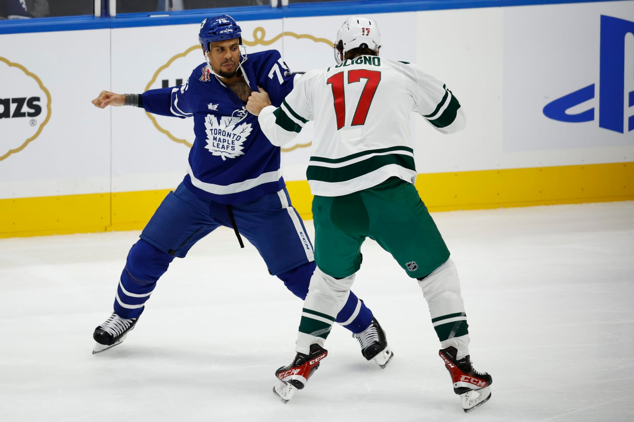 TORONTO. Toronto Maple Leafs Ryan Reaves ( l) fights Marco Folingo of the Minnesota Wild in a hard hitting first period. NHL action.(R.J.Johnston/Toronto Star)          (Photo R.J. Johnston Toronto Star/Toronto Star via Getty Images)