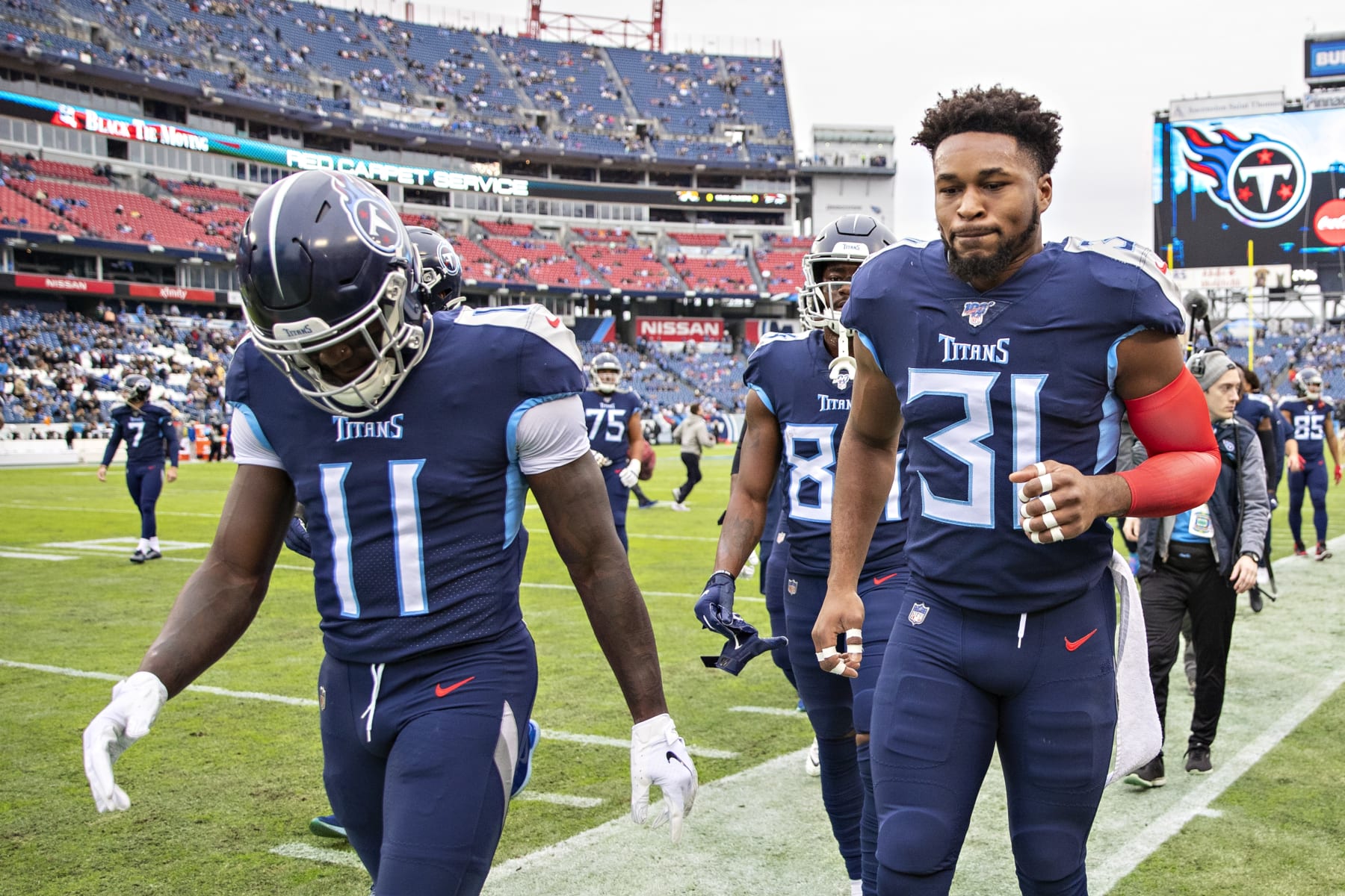 NASHVILLE, TN - DECEMBER 22:  A.J. Brown #11 and Kevin Byard #31 of the Tennessee Titans jog off the field before a game against the New Orleans Saints at Nissan Stadium on December 22, 2019 in Nashville, Tennessee. The Saints defeated the Titans 38-28.  (Photo by Wesley Hitt/Getty Images)