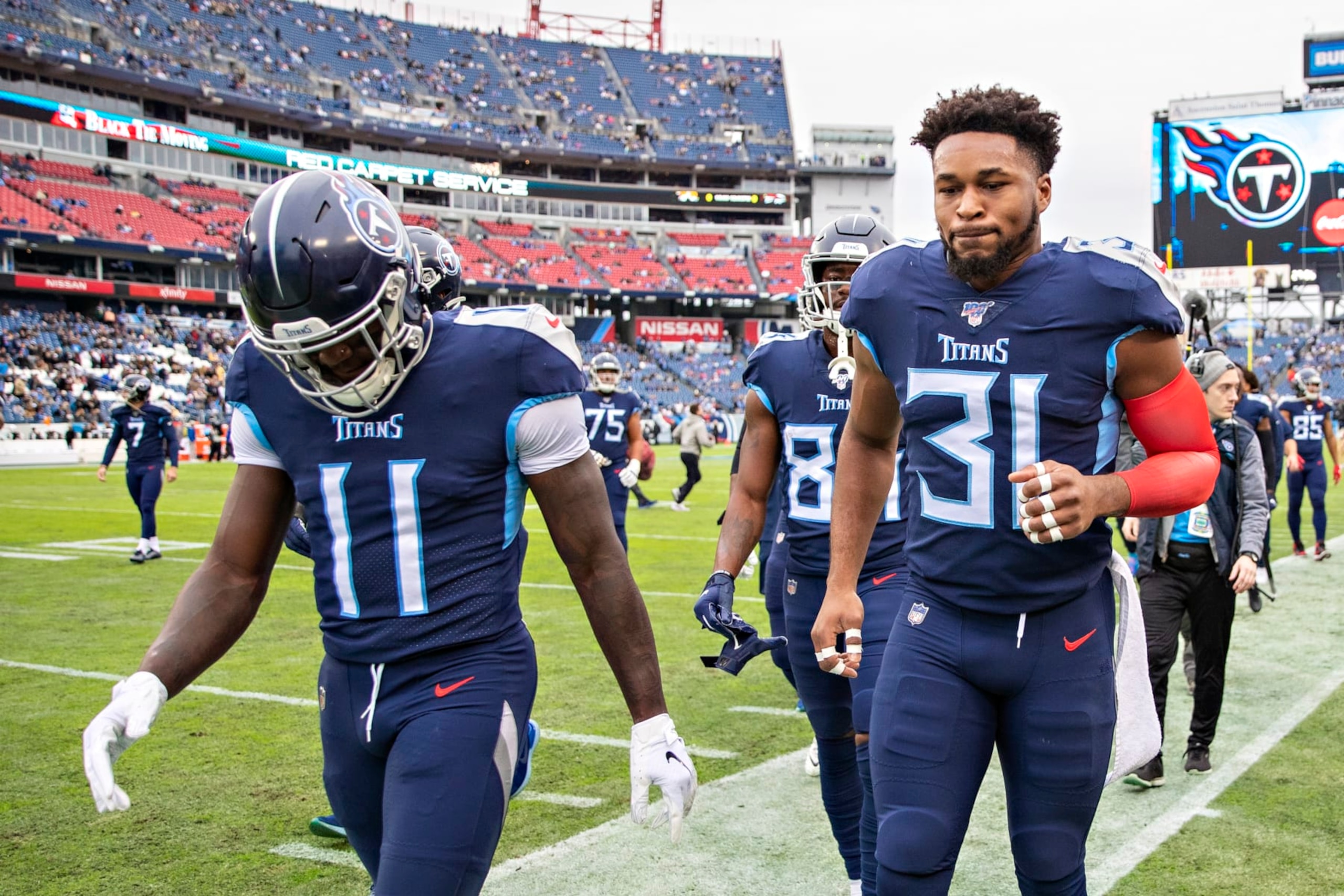 NASHVILLE, TN - DECEMBER 22:  A.J. Brown #11 and Kevin Byard #31 of the Tennessee Titans jog off the field before a game against the New Orleans Saints at Nissan Stadium on December 22, 2019 in Nashville, Tennessee. The Saints defeated the Titans 38-28.  (Photo by Wesley Hitt/Getty Images)