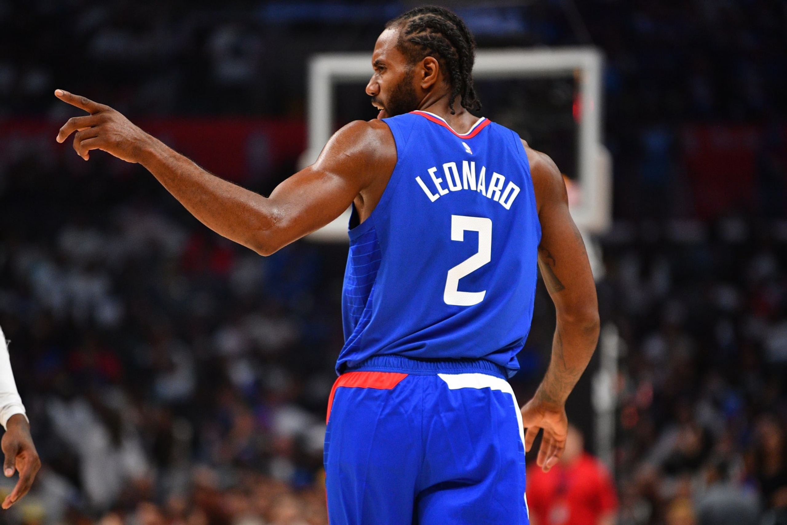 LOS ANGELES, CA - OCTOBER 25: Los Angeles Clippers forward Kawhi Leonard (2) looks on during a NBA  game between the Denver Nuggets and the Portland Trail Blazers on October 25, 2023 at Crypto.com Arena in Los Angeles, CA. (Photo by Brian Rothmuller/Icon Sportswire via Getty Images)