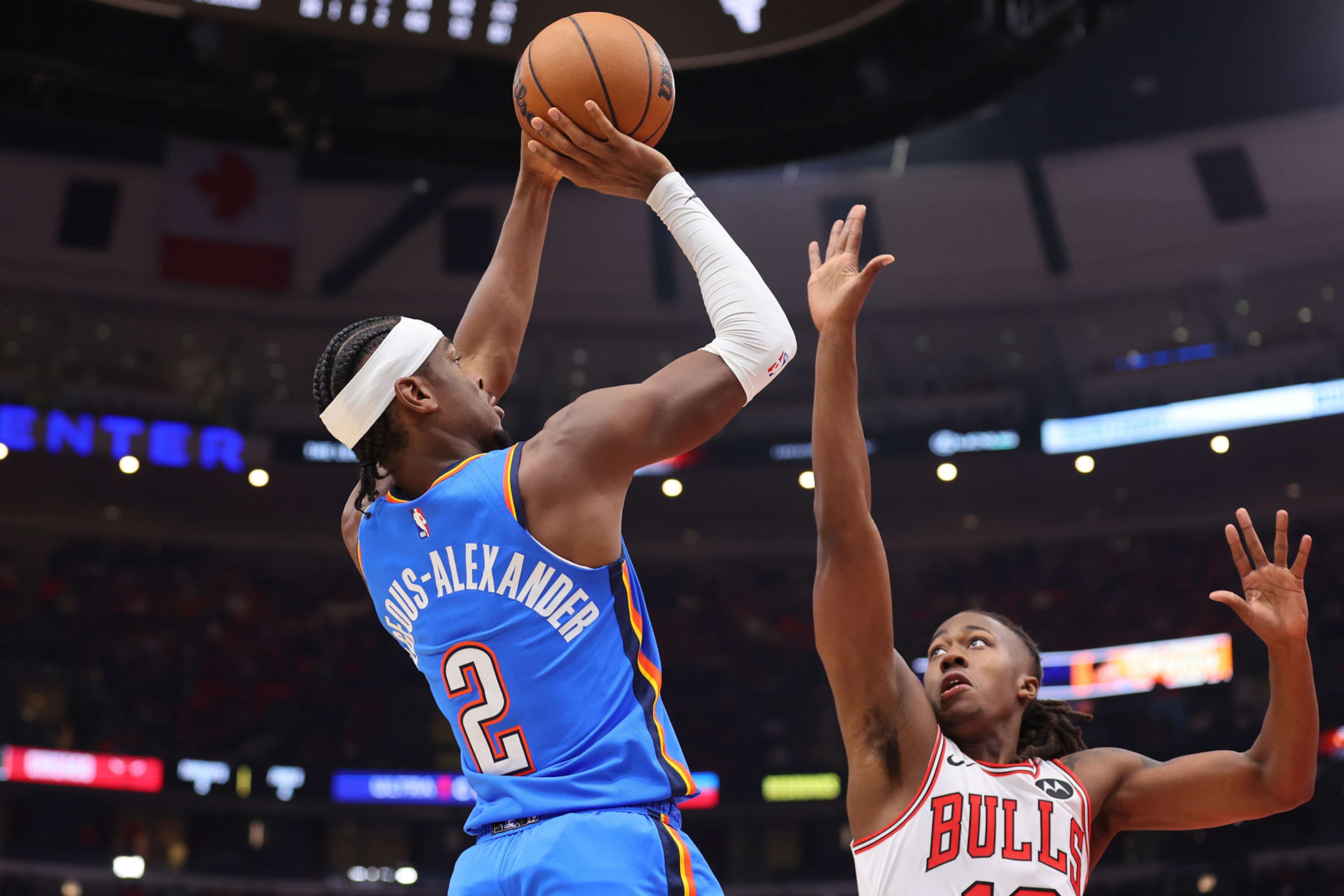 CHICAGO, ILLINOIS - OCTOBER 25: Shai Gilgeous-Alexander #2 of the Oklahoma City Thunder shoots over Ayo Dosunmu #12 of the Chicago Bulls during the first half at the United Center on October 25, 2023 in Chicago, Illinois. NOTE TO USER: User expressly acknowledges and agrees that, by downloading and or using this photograph, User is consenting to the terms and conditions of the Getty Images License Agreement. (Photo by Michael Reaves/Getty Images)