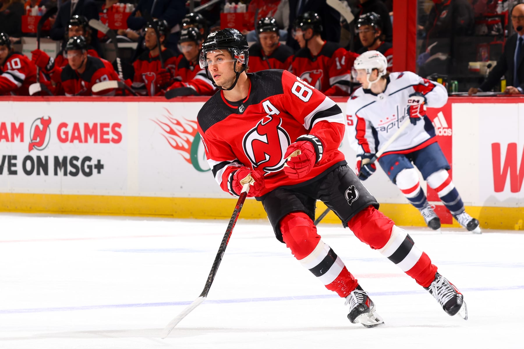 NEWARK, NJ - OCTOBER 25:  Jack Hughes #86 of the New Jersey Devils during the game against the Washington Capitals at the Prudential Center on October 25, 2023 in Newark, New Jersey.  (Photo by Rich Graessle/NHLI via Getty Images)