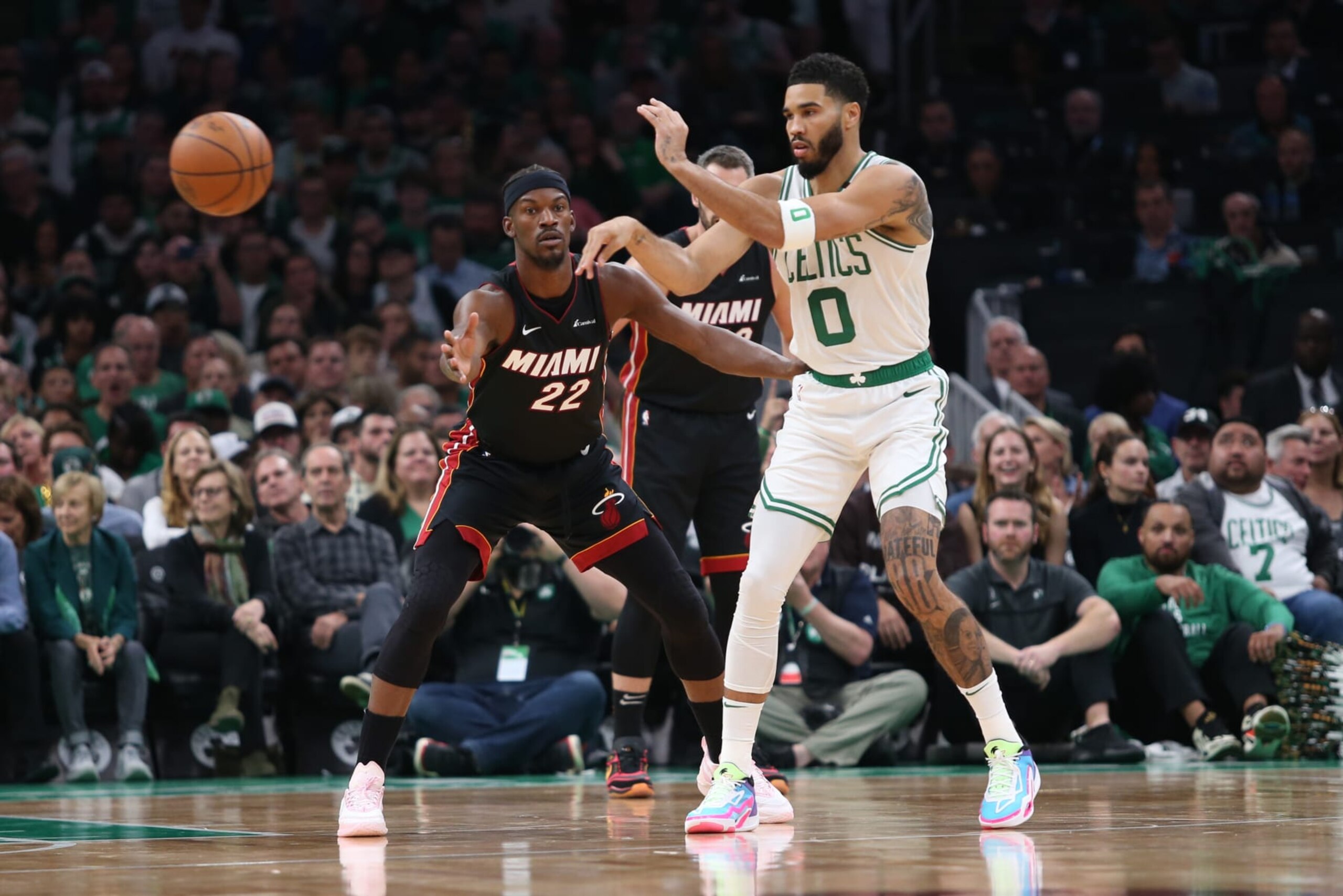 BOSTON, MASSACHUSETTS - OCTOBER 27: Jayson Tatum #0 of the Boston Celtics passes the ball beyond Jimmy Butler #22 of the Miami Heat in the first quarter at TD Garden on October 27, 2023 in Boston, Massachusetts. NOTE TO USER: User expressly acknowledges and agrees that, by downloading and or using this photograph, User is consenting to the terms and conditions of the Getty Images License Agreement. (Photo by Maddie Schroeder/Getty Images) BOSTON, MASSACHUSETTS - OCTOBER 27: Jayson Tatum #0 of the Boston Celtics passes the ball beyond Jimmy Butler #22 of the Miami Heat in the first quarter at TD Garden on October 27, 2023 in Boston, Massachusetts. NOTE TO USER: User expressly acknowledges and agrees that, by downloading and or using this photograph, User is consenting to the terms and conditions of the Getty Images License Agreement. (Photo by Maddie Schroeder/Getty Images)