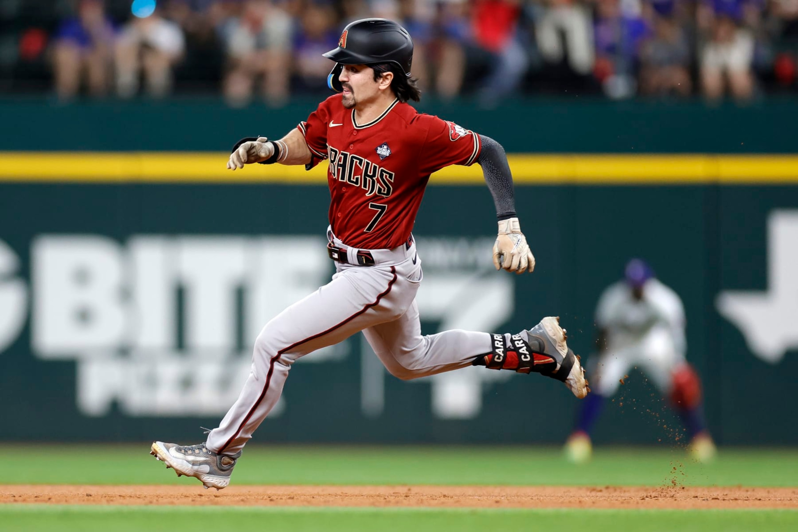 ARLINGTON, TEXAS - OCTOBER 27: Corbin Carroll #7 of the Arizona Diamondbacks runs to third base for a triple in the third inning against the Texas Rangers during Game One of the World Series at Globe Life Field on October 27, 2023 in Arlington, Texas. (Photo by Carmen Mandato/Getty Images)