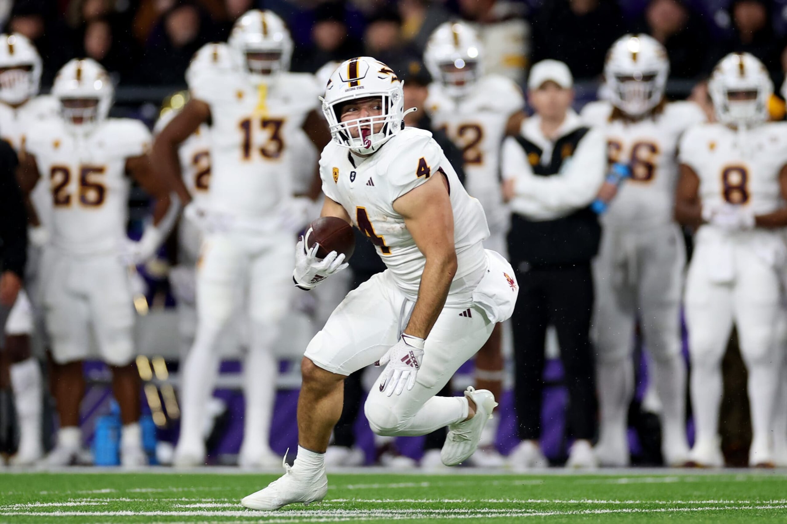 SEATTLE, WASHINGTON - OCTOBER 21: Cameron Skattebo #4 of the Arizona State Sun Devils carries the ball against the Washington Huskies during the second quarter at Husky Stadium on October 21, 2023 in Seattle, Washington. (Photo by Steph Chambers/Getty Images)