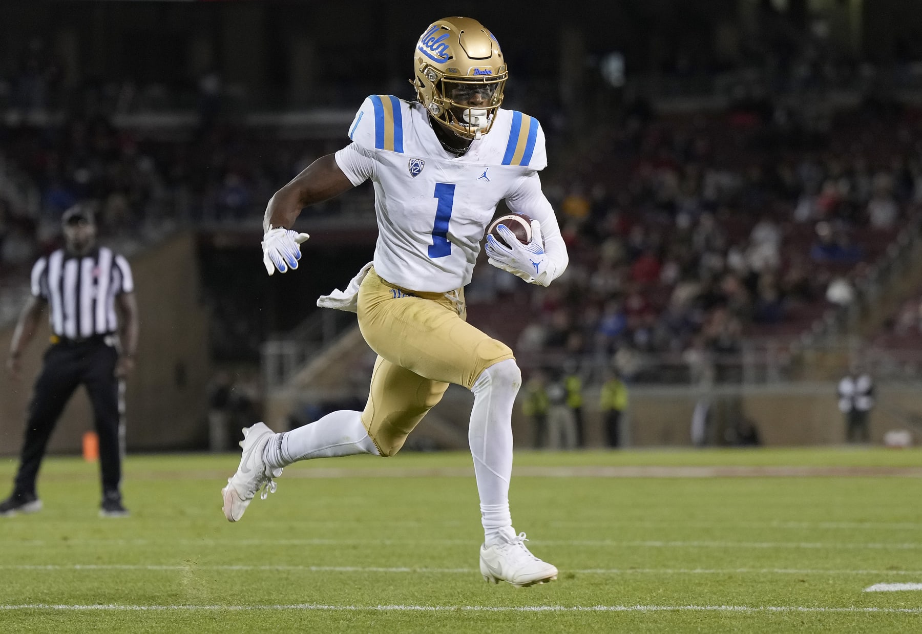 STANFORD, CALIFORNIA - OCTOBER 21: J. Michael Sturdivant #1 of the UCLA Bruins scores a touchdown on an eight yard pass play agains the Stanford Cardinal during the third quarter at Stanford Stadium on October 21, 2023 in Stanford, California. (Photo by Thearon W. Henderson/Getty Images)