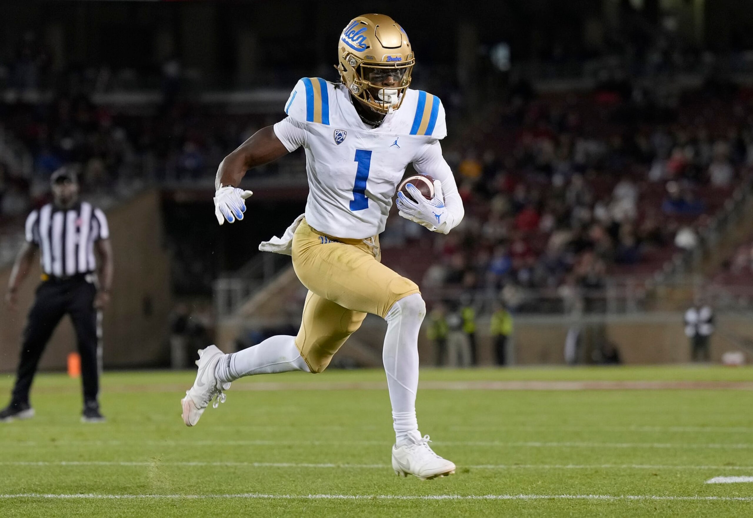 STANFORD, CALIFORNIA - OCTOBER 21: J. Michael Sturdivant #1 of the UCLA Bruins scores a touchdown on an eight yard pass play agains the Stanford Cardinal during the third quarter at Stanford Stadium on October 21, 2023 in Stanford, California. (Photo by Thearon W. Henderson/Getty Images)