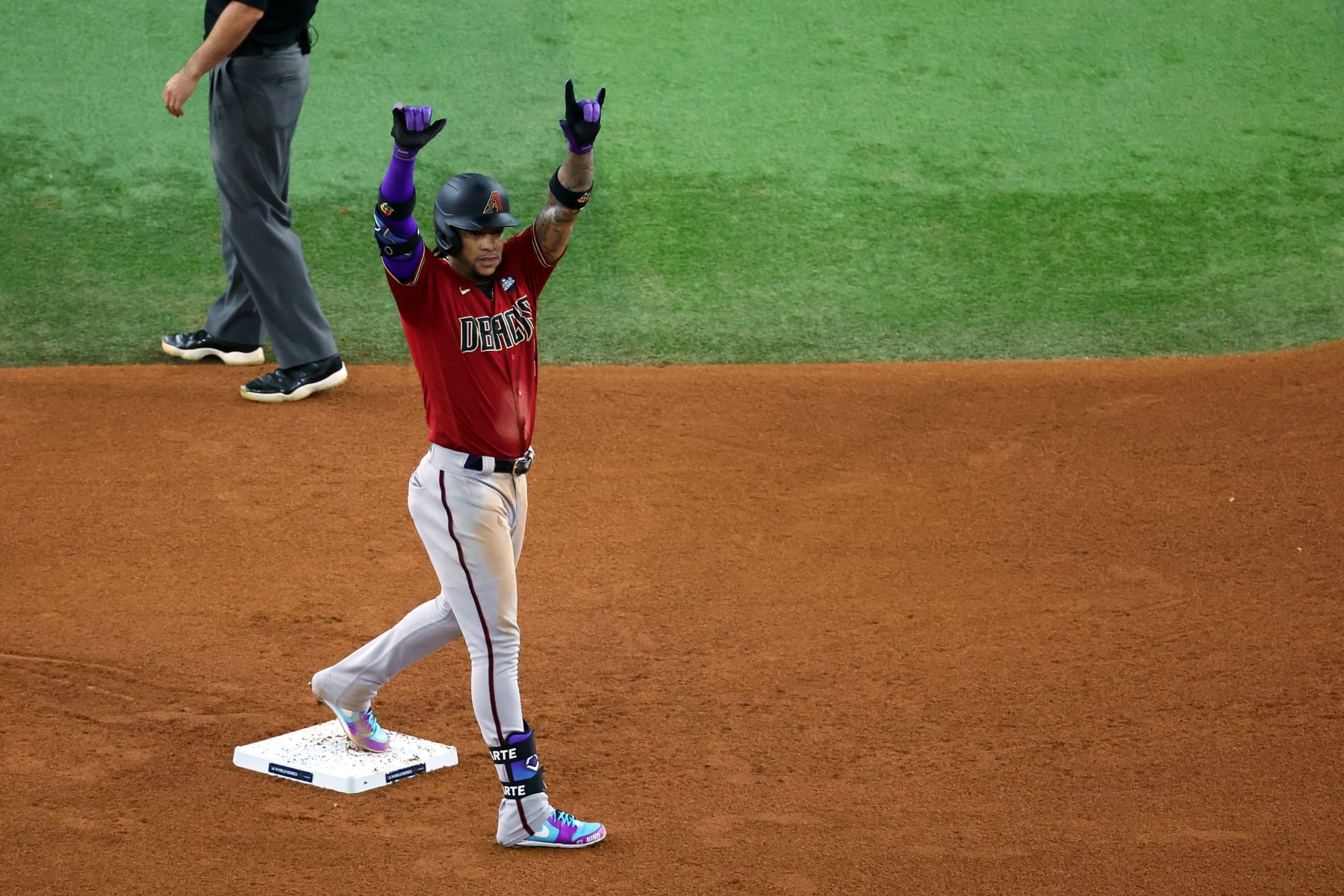 ARLINGTON, TEXAS - OCTOBER 27: Ketel Marte #4 of the Arizona Diamondbacks celebrates after hitting a double in the fifth inning against the Texas Rangers during Game One of the World Series at Globe Life Field on October 27, 2023 in Arlington, Texas. (Photo by Stacy Revere/Getty Images)