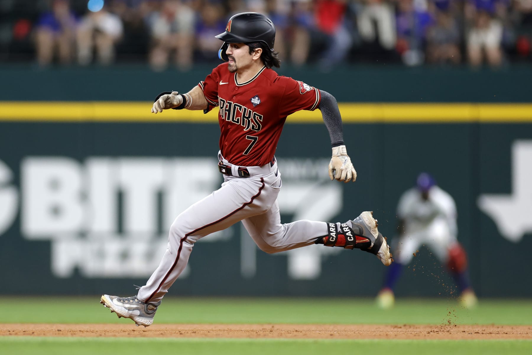 ARLINGTON, TEXAS - OCTOBER 27: Corbin Carroll #7 of the Arizona Diamondbacks runs to third base for a triple in the third inning against the Texas Rangers during Game One of the World Series at Globe Life Field on October 27, 2023 in Arlington, Texas. (Photo by Carmen Mandato/Getty Images)