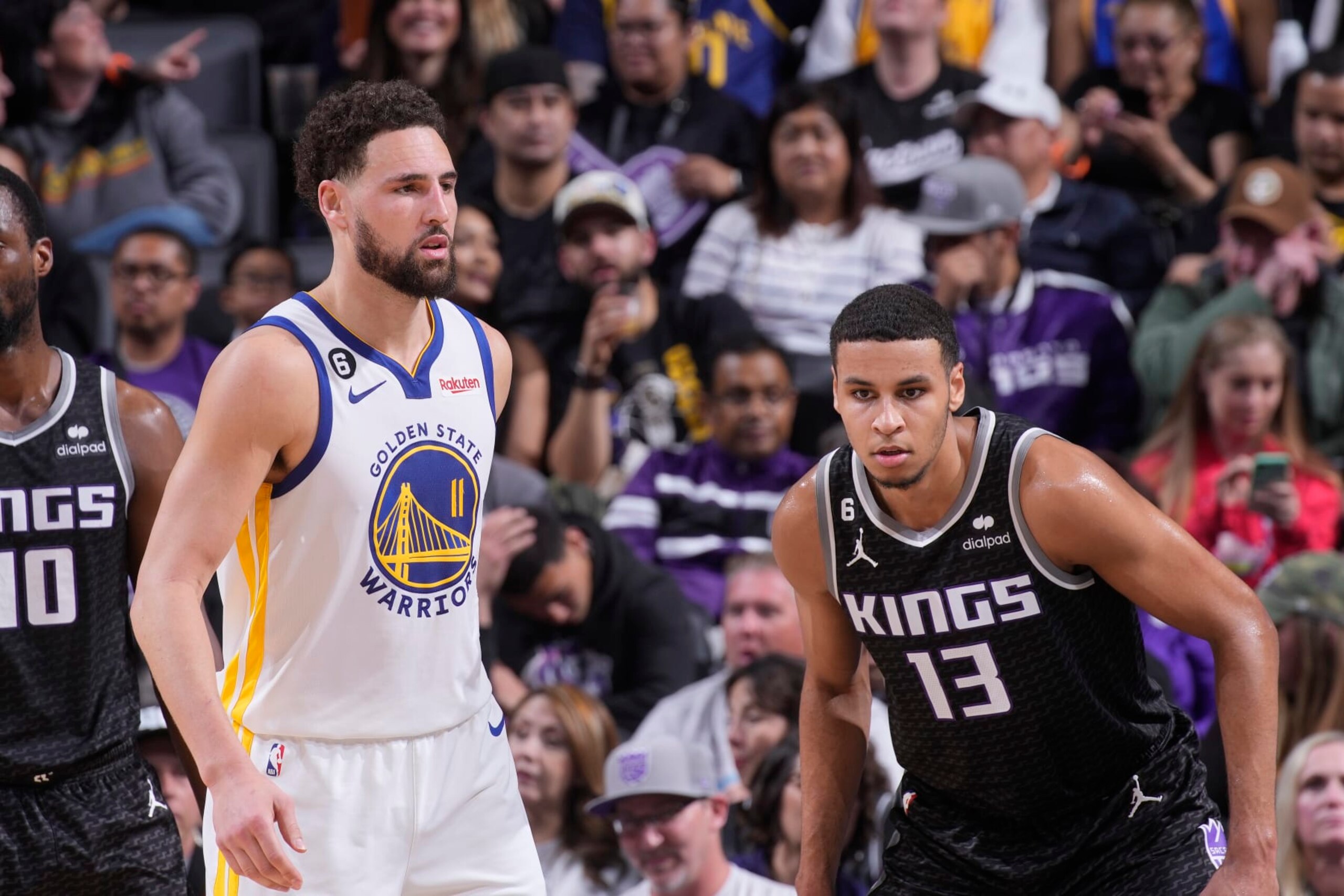 SACRAMENTO, CA - APRIL 7: Klay Thompson #11 of the Golden State Warriors and Keegan Murray #13 of the Sacramento Kings look on during the game on April 7, 2023 at Golden 1 Center in Sacramento, California. NOTE TO USER: User expressly acknowledges and agrees that, by downloading and or using this photograph, User is consenting to the terms and conditions of the Getty Images Agreement. Mandatory Copyright Notice: Copyright 2023 NBAE (Photo by Rocky Widner/NBAE via Getty Images)