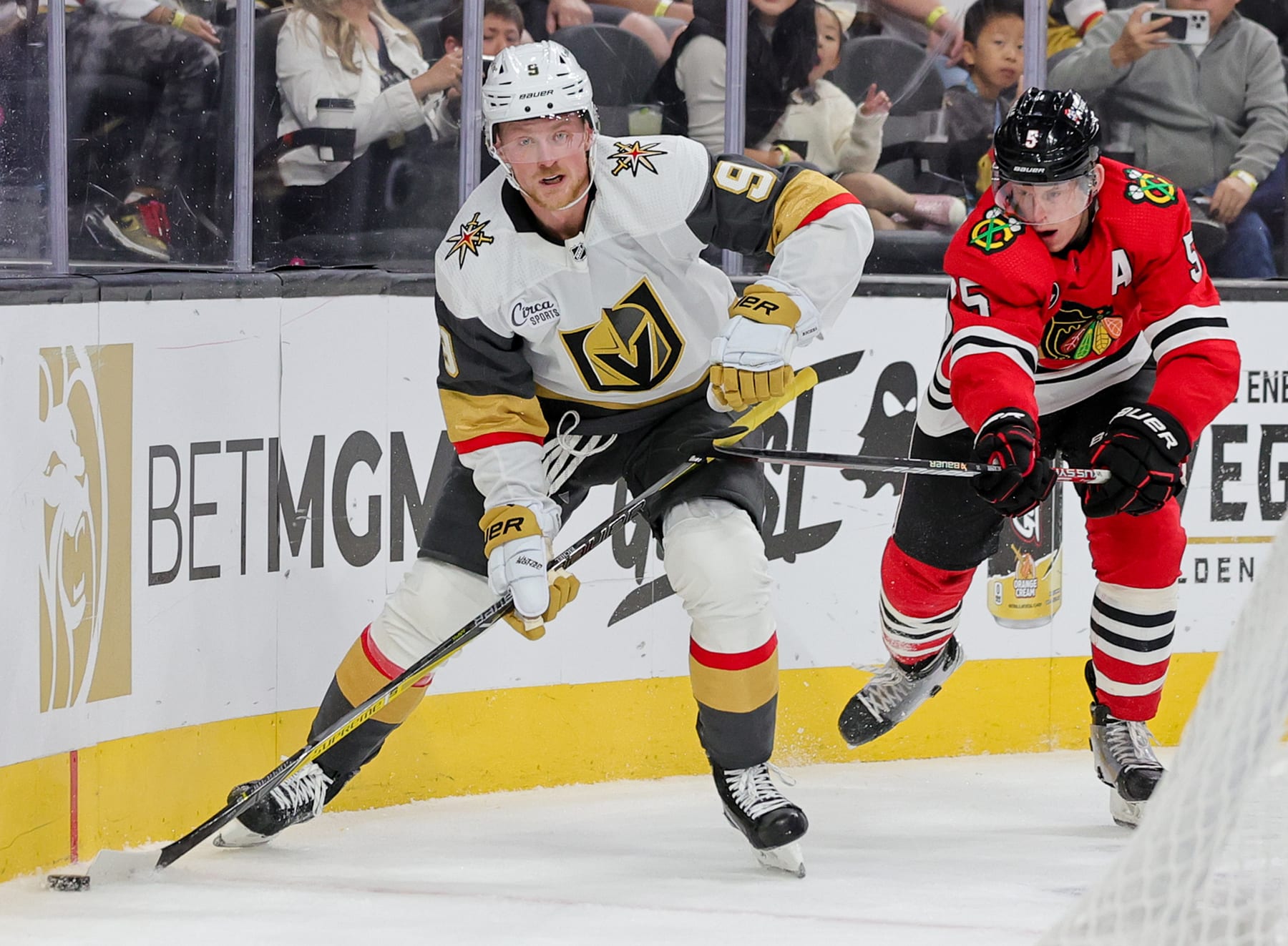 LAS VEGAS, NEVADA - OCTOBER 27: Jack Eichel #9 of the Vegas Golden Knights skates with the puck against Connor Murphy #5 of the Chicago Blackhawks in the second period of their game at T-Mobile Arena on October 27, 2023 in Las Vegas, Nevada. Murphy received a two-minute minor penalty for slashing on the play. The Blackhawks defeated the Golden Knights 4-3 in overtime. (Photo by Ethan Miller/Getty Images)